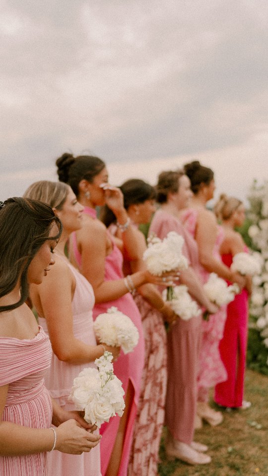 We saw that wind and she said, "I got this." We trained. We reviewed. She nailed it.
She made sure that cathedral length veil stayed PUT during the beautiful vine-backdrop ceremony.
Venue | @bigcorkvineyards
Caterer | @pigsbbq
Coordinator | @sleepingbeedesigns
Photographer | @leighannebraderphotography
DJ | @thedapperdjs
Floral Design | @Scentsationalfloraldesigns
Hair | @bethaniesbridalworld
Makeup | @theaimeenicolemua
Cake | @michelesbakeryandsweetshoppe
Bridal Salon | @poshbridalmd
Dress Designer | @missstellayork
Engagement Ring & Wedding Band | @rbrucecarsonjewelers @gabrielandco
Suit | @ingramsmensshop
Wedding Coordinator
Frederick Wedding
Frederick MD
Pink Bridesmaids Dresses
Winery Wedding
Cathedral Length Veil