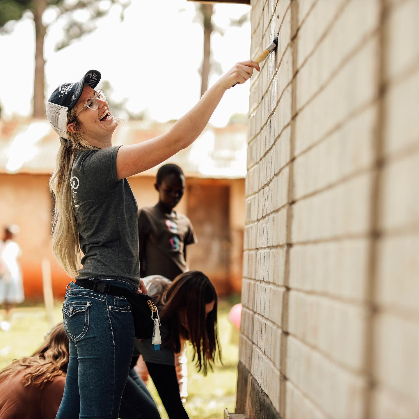 On day 1 of projects at @mattawchildren, half of the group has been spending time repainting the schoolhouse walls rooms // It‘s clear the kids aren’t going to miss out on an opportunity to join in on the fun ❤️ // 📷: @happycamperfilms
