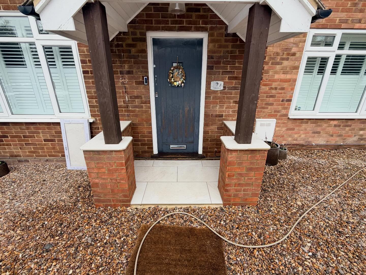 Just wrapped up a small project where the wooden posts had rotted in the ground so I dug some footings and built a small wall to support the posts and added a porcelain step into the property it looks so much better now #alderson #building #brickwork #brickie #porcelain