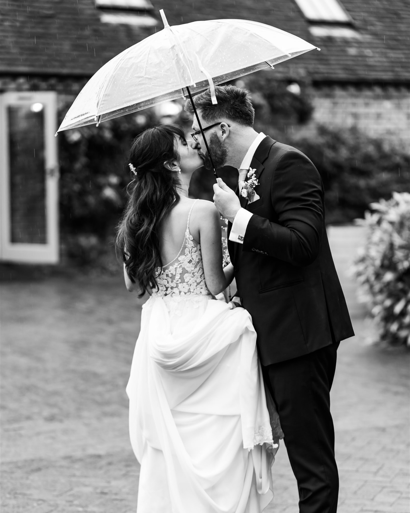 “What happens if it rains?”
A question I get asked by most couples! The good old British weather can be rather unpredictable and it’s the one thing you can’t plan or control on your wedding day.
♥ Embrace it!
Ultimately it’s all about marry your person and celebrating with all of your favourite people. Rain might mean changing a few plans, but it absolutely doesn’t have to ruin your day.
♥ Be prepared!
Clear umbrellas are perfect for staying dry while still letting in lots of natural light for photos (and I always bring a couple with me!)
♥ It never lasts all day!
In all my years photographing weddings, I’ve never had a full day of nonstop rain. There’s always a break at some point where we can pop outside for photos!
♥ It’s actually quite romantic!
I’m totally a hopeless romantic (I love a romcom) and some of the most iconic love stories in movies happen in the rain. That kiss in The Notebook! Four Weddings and a Funeral “Is it still raining? I hadn’t noticed…” The famous upside down kiss in Spider-Man. (Not a romcom I know, but still iconic!) And although it snow rather than the rain, I can’t not give Bridget Jones a mention “nice boys don’t kiss like that…” Basically my point is, there is something about a bit of rain that makes the photos feel romantic and cinematic!
#rainonyourweddingday #rainwedding #weddingrain