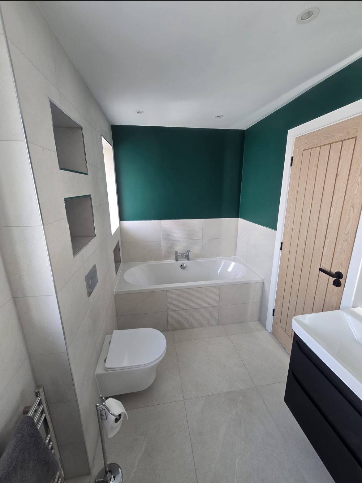 Another beautiful renovation completed over in Camberley! 📍✅
Swipe through to see how this project made it from design to reality thanks to Dan and Aaron at @D&ZBathrooms 🔥
This room took warm neutrals with dark-tone greens and a striking black vanity to create a calming yet vibrant atmosphere in the home 🌟💚
This bathroom used the following products:
🇮🇪 Merlyn’s Touchstone tray with Mershield protected Walk-in glass 🧽
🇬🇧 Aqualisa’s brilliant Quartz Classic Digital shower 📳
🇬🇧Britton’s Cleargreen Verde bath for ultimate bathing comfort 🛀
🇬🇧 Veldeau and their Byford Solid black vanity unit with the Abano ceramic basin ☑️
🇬🇧R2’s Fuse basin and bath taps accompanied by the Rondo WC frame and plate with a Sky wall hung pan and Pure LED back-lit mirror 💪🏻💡
🇪🇺JIS Europe’s stainless steel Newick towel warmer ♨️
Finished off with a blend of tiles from our Tile Collection!
Delta White in 600mm x 600mm format on the floor
Delta White in 600mm x 300mm format on the walls
Delta White Textured Decor tiles in a vertical strip in the shower and in the centre of the bath
Naples Green in the backs of the Niches to tie in with the lovely green paintwork on the walls 🌱
@jiseuropeltd @r2bathrooms @aqualisashowers @brittonbathrooms @merlynshowering @veldeaubathrooms
#greenbathroom #bathroom #luxuryhomes #cad #bathroomdesign