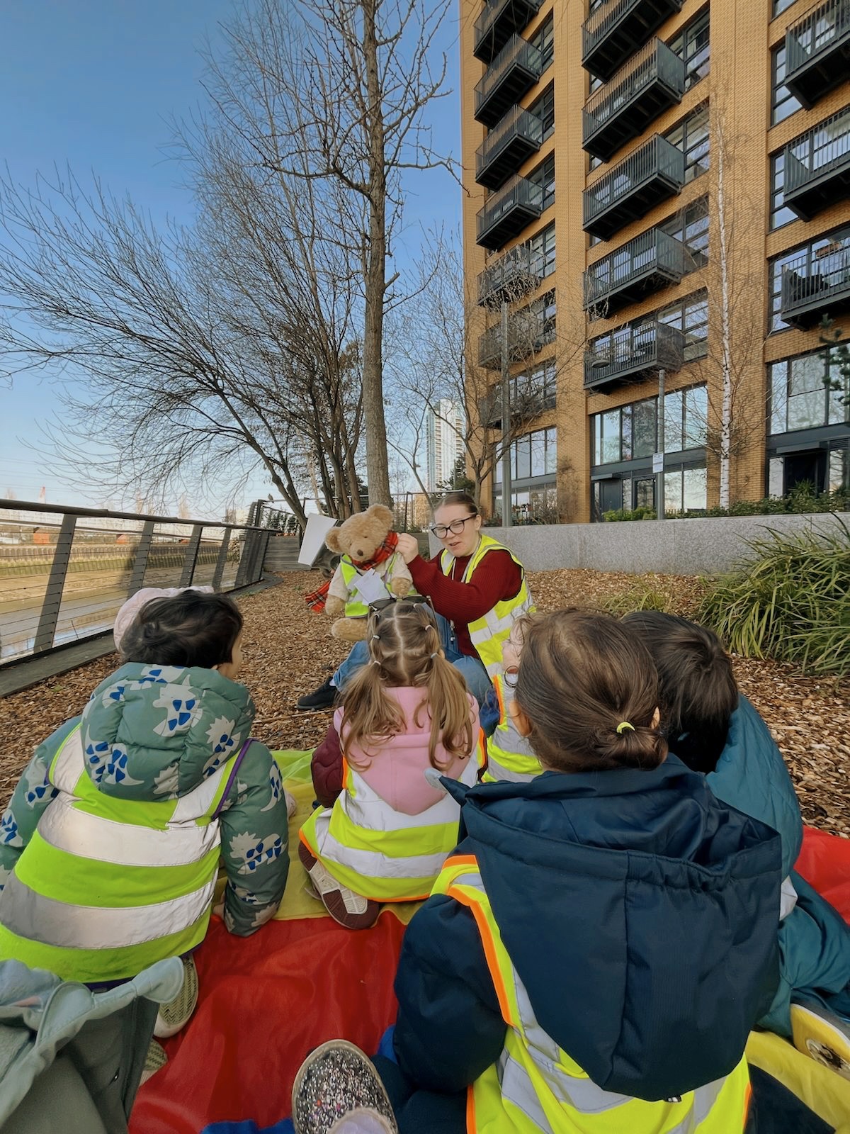 Meet Mr Tim Tim - Our Outing Bear 🧸🦺
The children went on a walk in the local environment with Mr Tim Tim, our Health and Safety advisor – “bear in mind, safety first!” 😊
The children learned about simple road safety routines as they walked together, turning on their listening ears, staying aware of their surroundings, and moving carefully in a line. The children showed lots of confidence in being outside the nursery in the care of familiar adults. As they took part in the walk they followed simple instructions and routines.
Sharing experiences together like this deepen the children’s bonds with each other and the adults who take care of them. Shared experiences are a powerful way for children to grow socially, emotionally, and intellectually ✨
A lovely way to learn together beyond the nursery walls 💛
#EarlyYears #LearningThroughExperience #Outings #ChildDevelopment