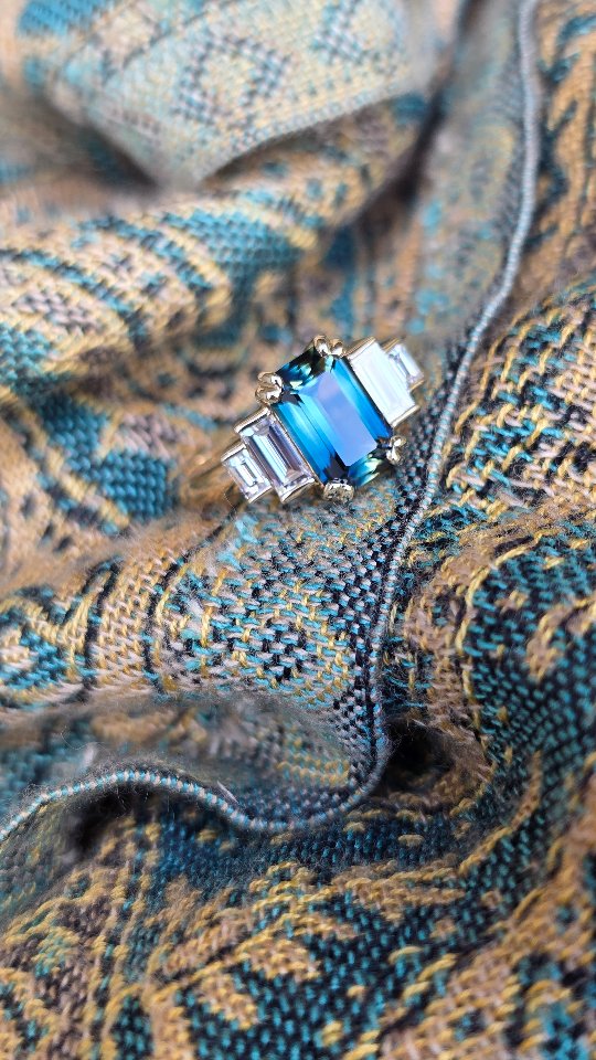 With a vow renewal on the horizon, Erin and Jake were looking to celebrate the occasion with an updated engagement ring featuring an Australian sapphire. It was love at first sight all over again once Lauren saw this 2.38 ct Emerald cut with an incredible display of natural blue and yellow tones. Handcrafted with elegant double claws and graduating baguette cut white diamonds.
To view our available Sapphires and Bespoke jewellery designs email sales@thehouseoffacets.com.au or visit our website to book an online or in person consultation.
www.thehouseoffacets.com.au
#engagementring #bespokering #handcrafted #australiansapphire