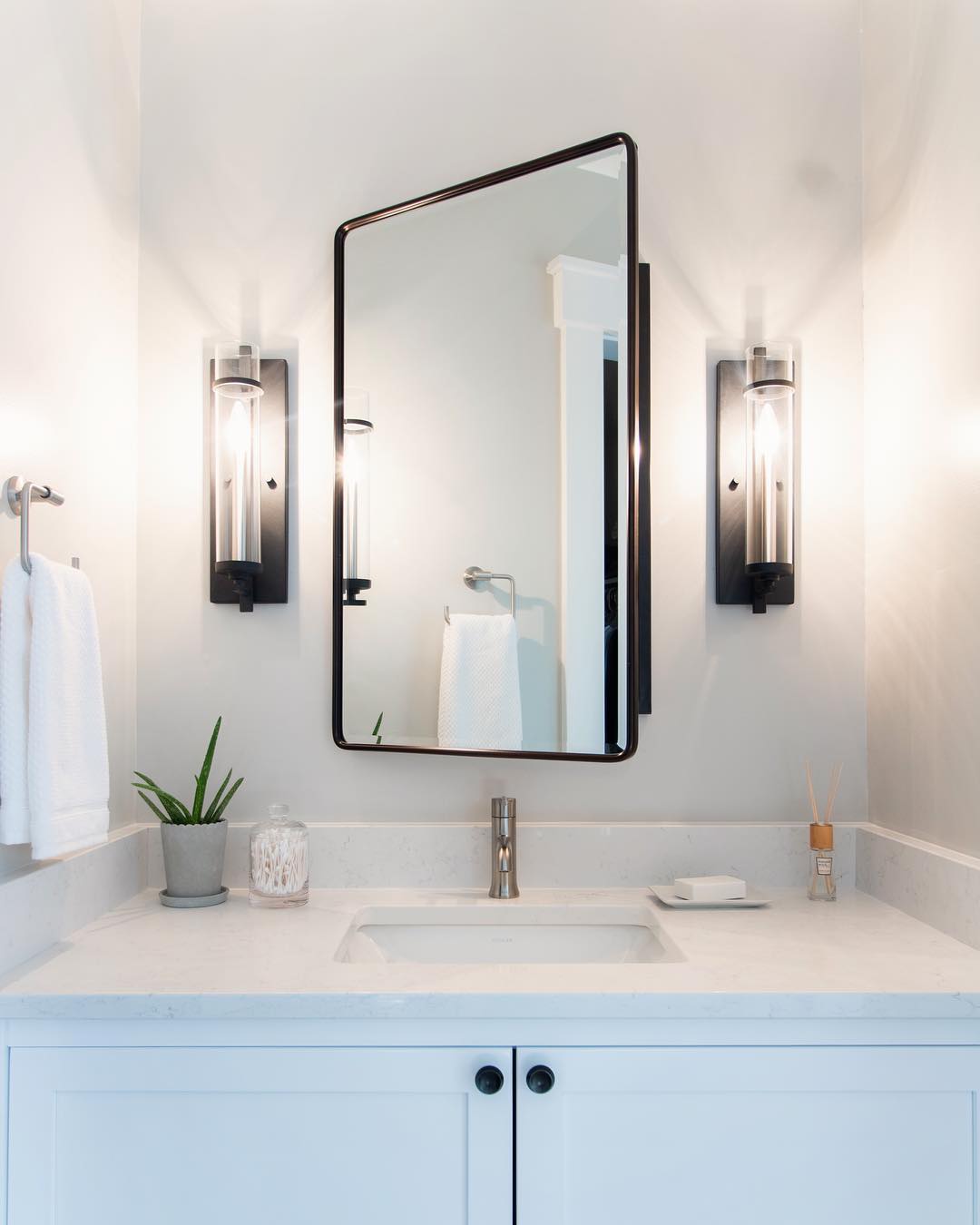What do you guys think about this before & after? 😜😍 .
.
.
#bathroomremodel #remodelproject #beforeandafter #potterybarn #wallsconce #bathroomvanity #aloevera #deltafaucet #kohlersink #quartzcountertops #interiordesign #interiordesigner #interior_and_living #interior4all #designsponge #masterbathroom #anthropologiehome #lightandbright #neutralpalette #medicinecabinet #potterybarnmedicinecabinet #housetohome #interiordesinglovers #howyouhome #modernliving #residentialdesign #bathroomrenovation #renovation #sodomino #interiorstyle