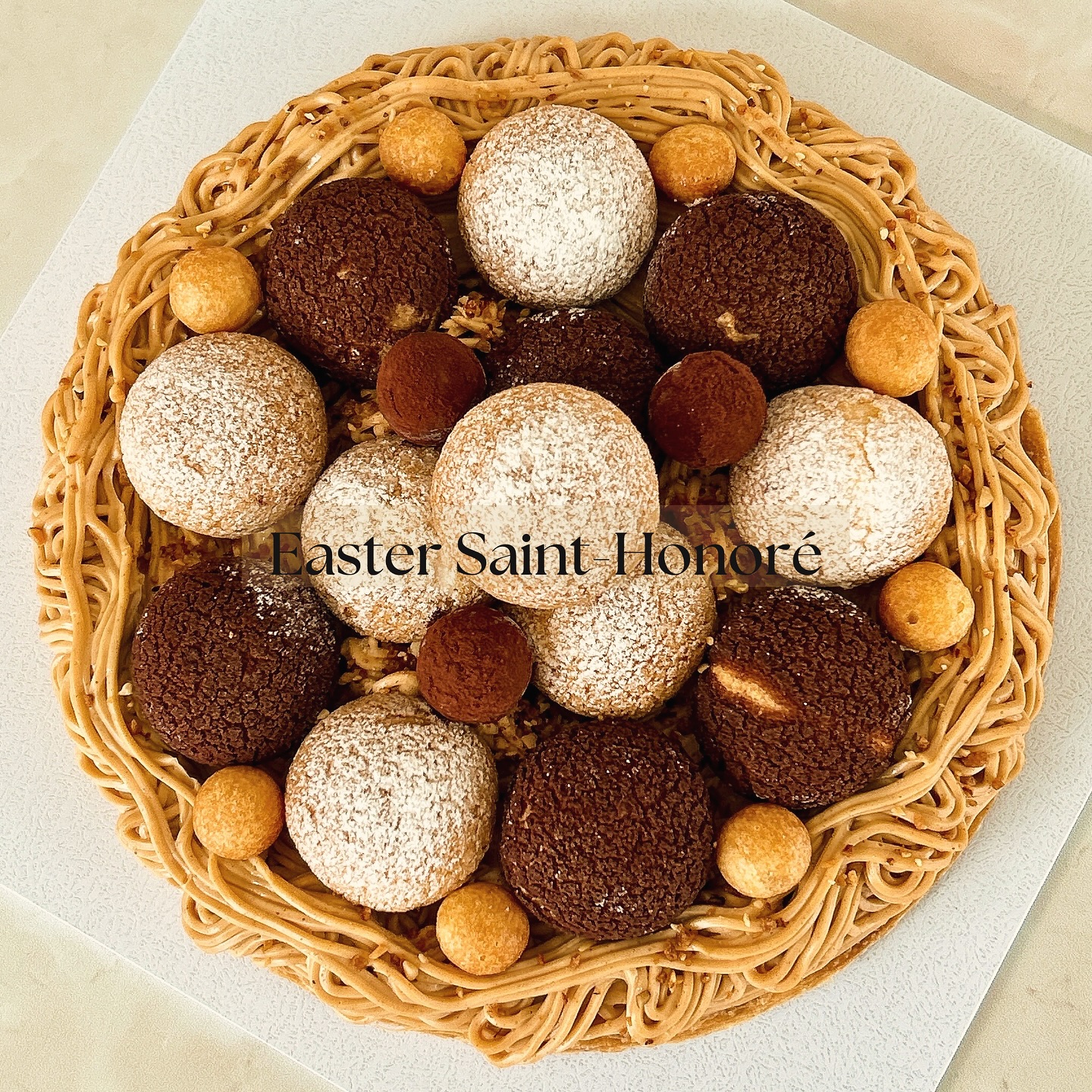 EASTER SAINT-HONORÉ ✨
A French classic, reimagined for Easter.
Built on a buttery puff pastry base, layered with a rich almond & hazelnut praline cream inspired by the Paris-Brest, and finished with an assortment of handcrafted choux craquelin: chocolate filled with a light milk & dark chocolate chantilly, and vanilla with a delicate vanilla chantilly.
Completed with mini choux, crunchy French praline, and dark chocolate tonka bean namelaka truffles.
A refined balance of textures: crisp, airy, creamy, and deeply indulgent.
Made to share (serves 8-10)
Limited time only
Last day to order: Tuesday 31.03 (unless sold out prior)
Very limited quantities available
Pre-order now.
#frenchpatisserie #hautepatisserie #pastryart #pastrychefsofinstagram
#luxurydesserts #dessertsofinstagram #beautifuldesserts #pastrydesign
#frenchdessert #artisanpatisserie #frenchpastrychef
#foodphotography #foodstyling #dessertgram
#sydneydesserts #sydneyfood #sydneypatisserie
#easterdessert #easter2026 #eastertable