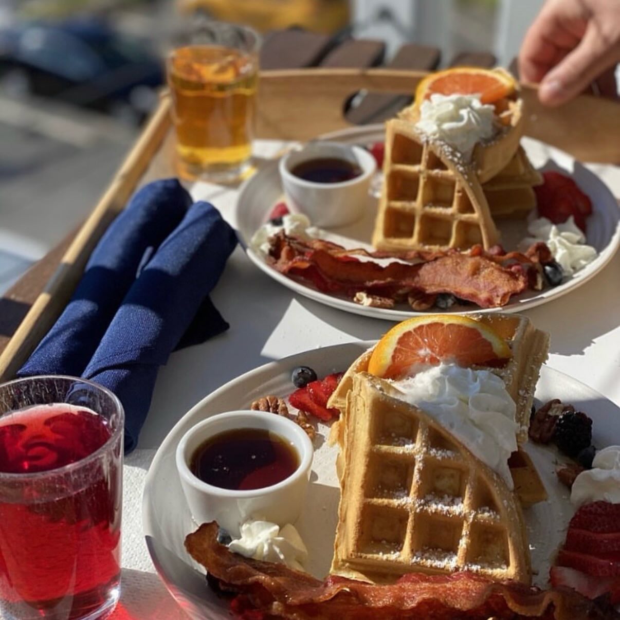 Fresh waffles on the table. Come join us! 🧇🍓☕️