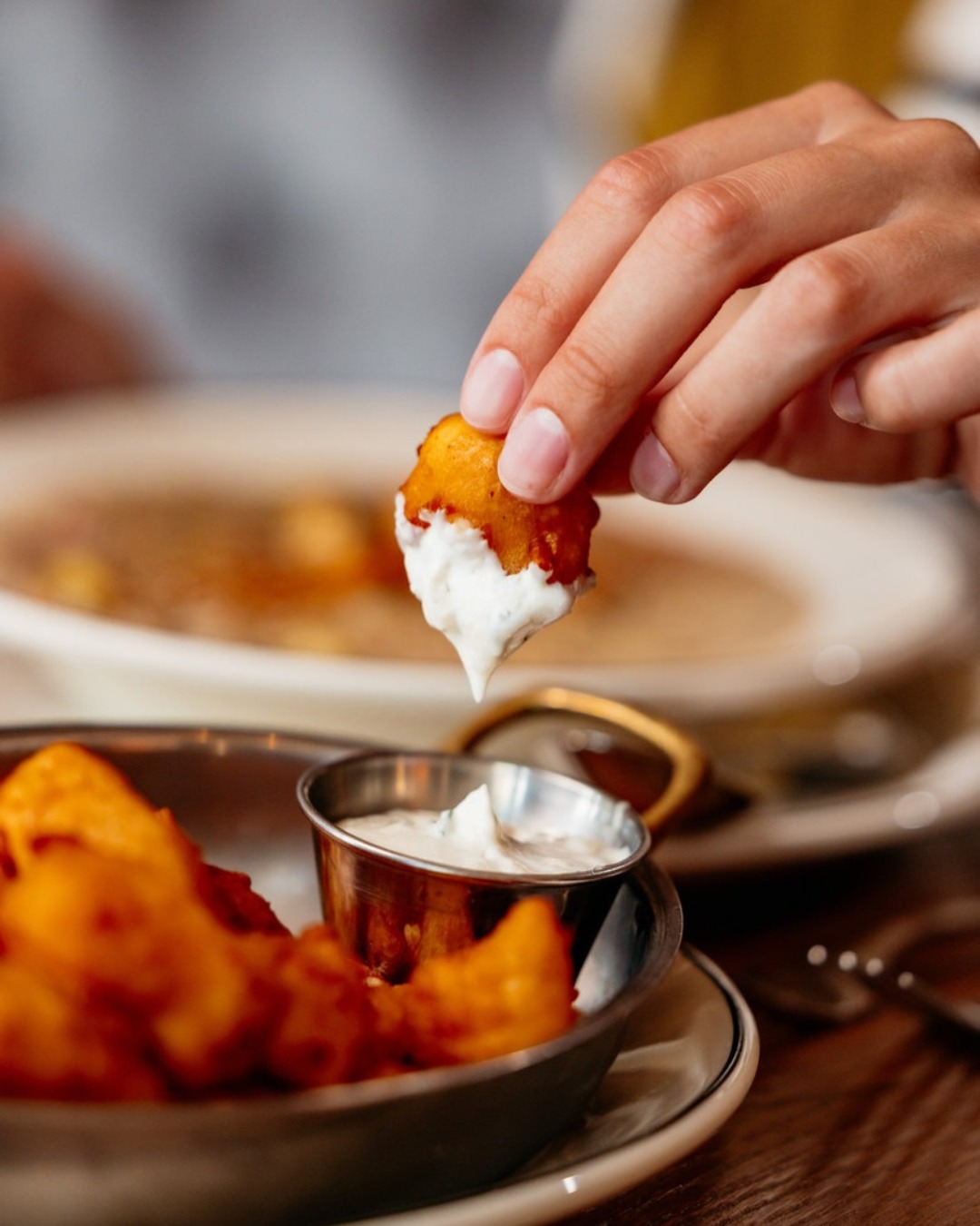 Fun fact: Wisconsin supper clubs grew out of rural taverns and resorts, places where an evening was meant to unfold slowly, from cocktails to dinner and everything in between.
Somewhere along the way, cheese curds found their place in that ritual. Fresh from the creamery, known for their signature squeak, and eventually served golden and crisp as the first bite of the night.
A proper beginning, if you ask us.