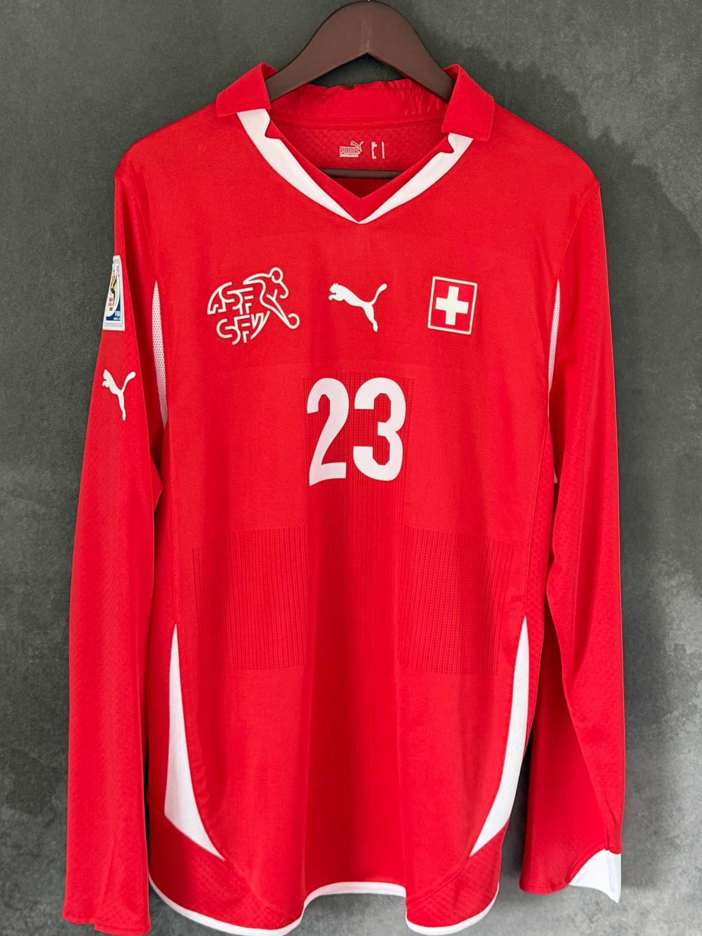Switzerland 2010 Home by @puma featuring Basel Baller Xherdan Shiqiri
When a simple design with some thought out details actually make a really smart shirt
On first glance this is just a plain red jersey, but the details make it so much more
The vented fabric on the front actually make the cross that’s obviously a focal point on the countries flag
The flag on the shirt has this really nice textured background which just adds a layer of quality
The silicon Swiss football federation logo is also a really nice touch
I think this shirt really works as a long sleeve, as the fabric is ultra light, it’s also one of the few player spec shirts that still keeps it shape without turning into some hideous skin fit
A bit about the player..
A mans whose club career seems to have gone backwards, not necessarily in a bad way but just not what you would expect from a guy who has such incredible talent
Starting at FC Basel before a big move to Bayern Munich where he won 3 Bundesliga titles in a row whilst only playing 52 games in all competitions.. a 15 million euro move to Inter only to be sold to Stoke city 3 months later. A really decent spell at stoke but ended up getting relegated to the be sold to Liverpool. Another 3 years at Liverpool only making 45 appearances before a move to Lyon, 11 appearances later he joined Chicago Fire and actually racked up an impressive 69 appearances in just 2 seasons.. now back at his boyhood club Basel, he is a regular starter and still playing some of his best football
2010 saw him make his senior debut for Switzerland since then he has made an incredible 125 appearances scoring 32 goals
A cult hero in football and one of those players the streets won’t forget
Let me know what you think about the shirt and the player
My score is a solid 8/10
#suisse #eagle #football #footballshirt #worldcup