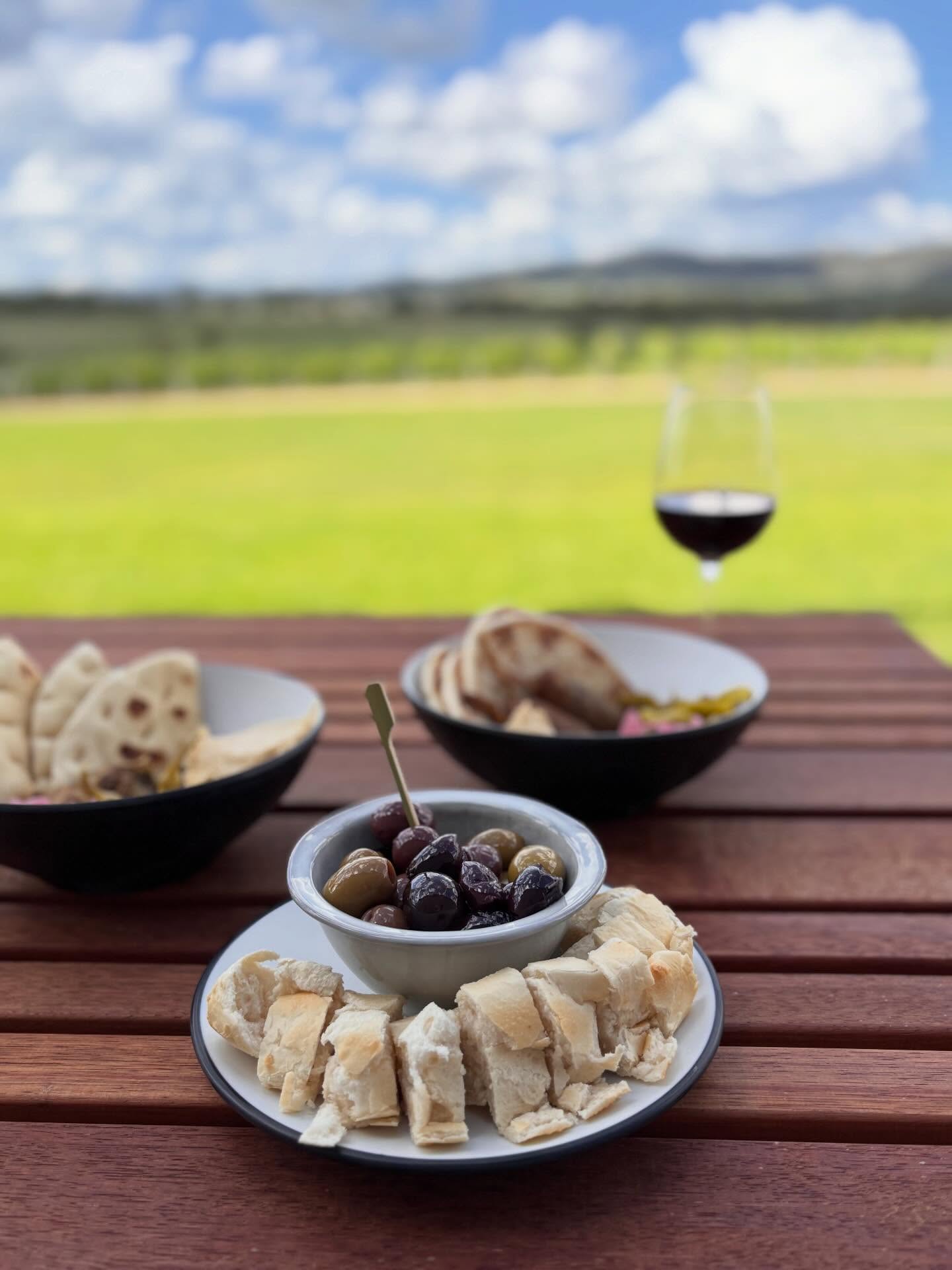 Mixed olives with a toasted baguette and cultured butter 🤤 available at both New Tricks Distillery and Winery