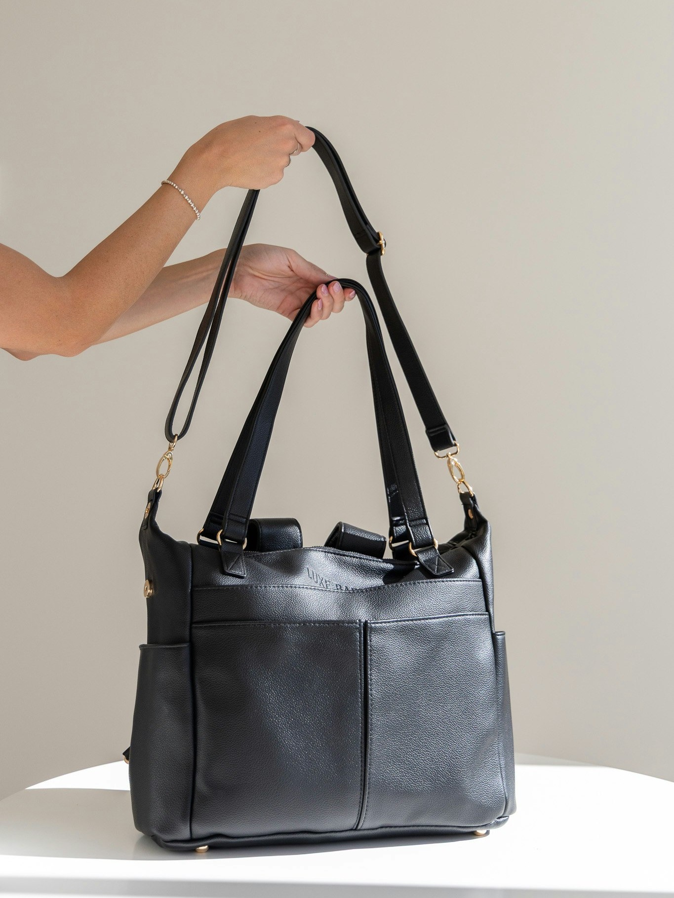 One bag, many ways.
Wear it as a handbag, add the strap for crossbody, or switch to backpack mode when you need hands free.
The Ivy Convertible Bag is made for real life with kids.
