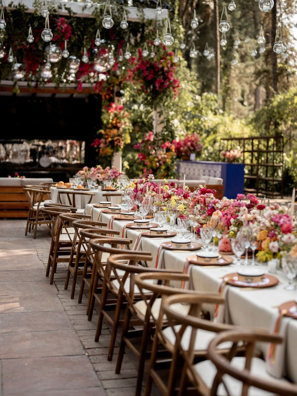 Layers of blush and rose-toned blooms set the scene, while unexpected pops of vibrant colour bring everything to life. Above, cascading candles float like a dream, casting the most magical glow as the night unfolds.
Design and Full Wedding Planning: @living_fortomorrow
Photography: @molvoweddings
Wedding Dress: @lavenderfieldsbridal
Bespoke Jewellery: @maestrosjoyeros
Bespoke Floral Ribbon @gigiandolive_
Catering: @kiuquintanacatering
Stationery: @maria.mekhael.design
Furniture: @sandybodas & @acentodemesamx
Florals: @tallerdetallos
Production: @Ricardo_saher_eventos
Venue: @ranchojuantepec
#mexicocitywedding #mexicoweddingplanner #valledebravo #pinkflowers