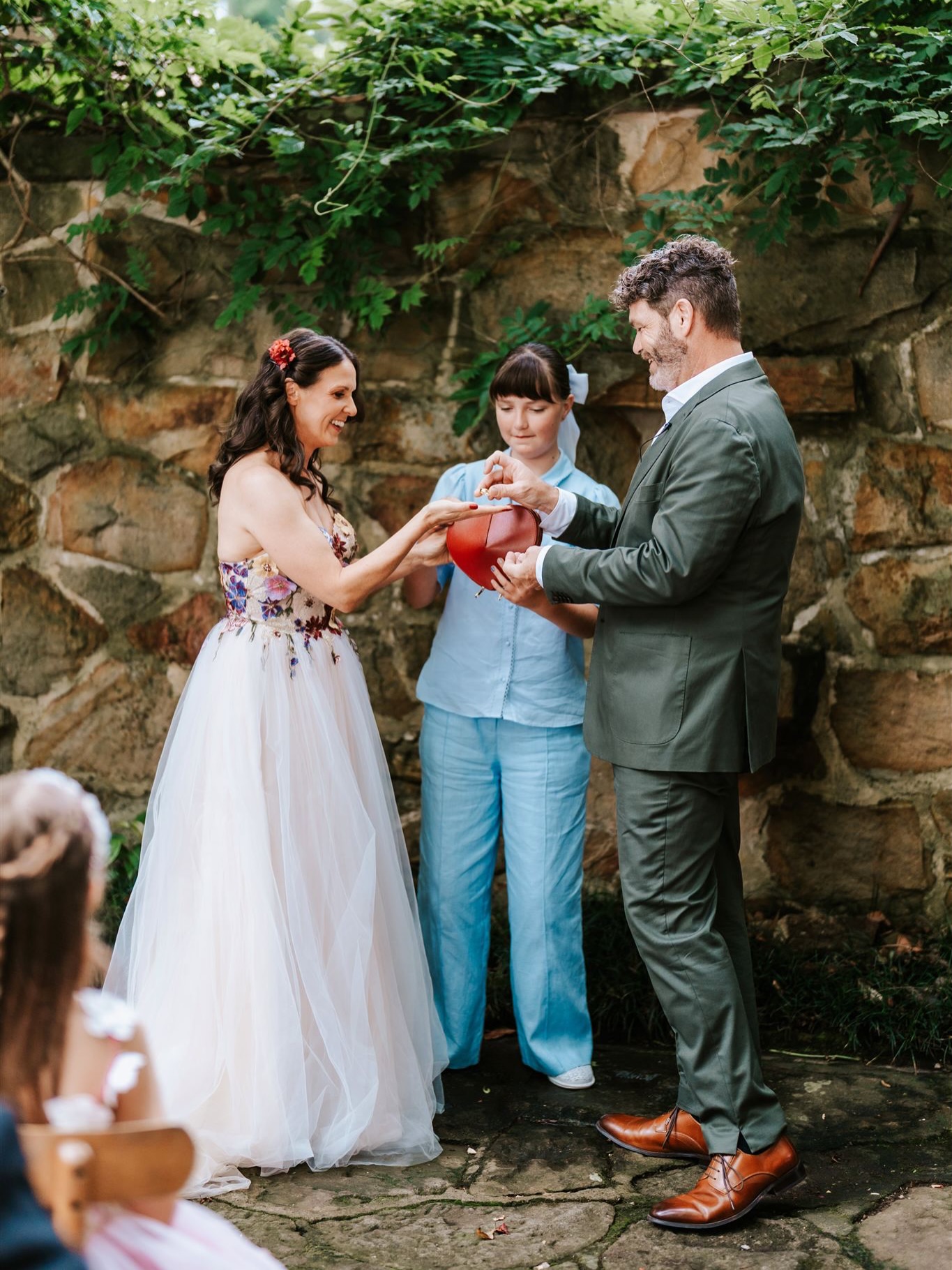 A wedding ring bearer with a difference. This little Italian leather heart bag began life as a Valentine’s Day gift… but the moment it was unwrapped, both of us had the same thought.
“I can use this in my wedding ceremonies”.
‘And just like that’, it becomes something that holds a moment of anticipation.
❤️Instead of the traditional ring box, the couple unzip the heart to reveal their rings or vows. It becomes a focus point, certainly larger than a ring box.
It opens the door for a young family member to be part of the ceremony.
🥂Let me know if you would like to have the red heart in your ceremony. Confetti, chocolate, vows, rings, tissues, mini bottles of bubbles….
Wollongong wedding, Wollongong celebrant.
#southcoastcelebrant #wollongongwedding
Photo credit @better_together_photo_co
Venue @rubys_mount_kembla