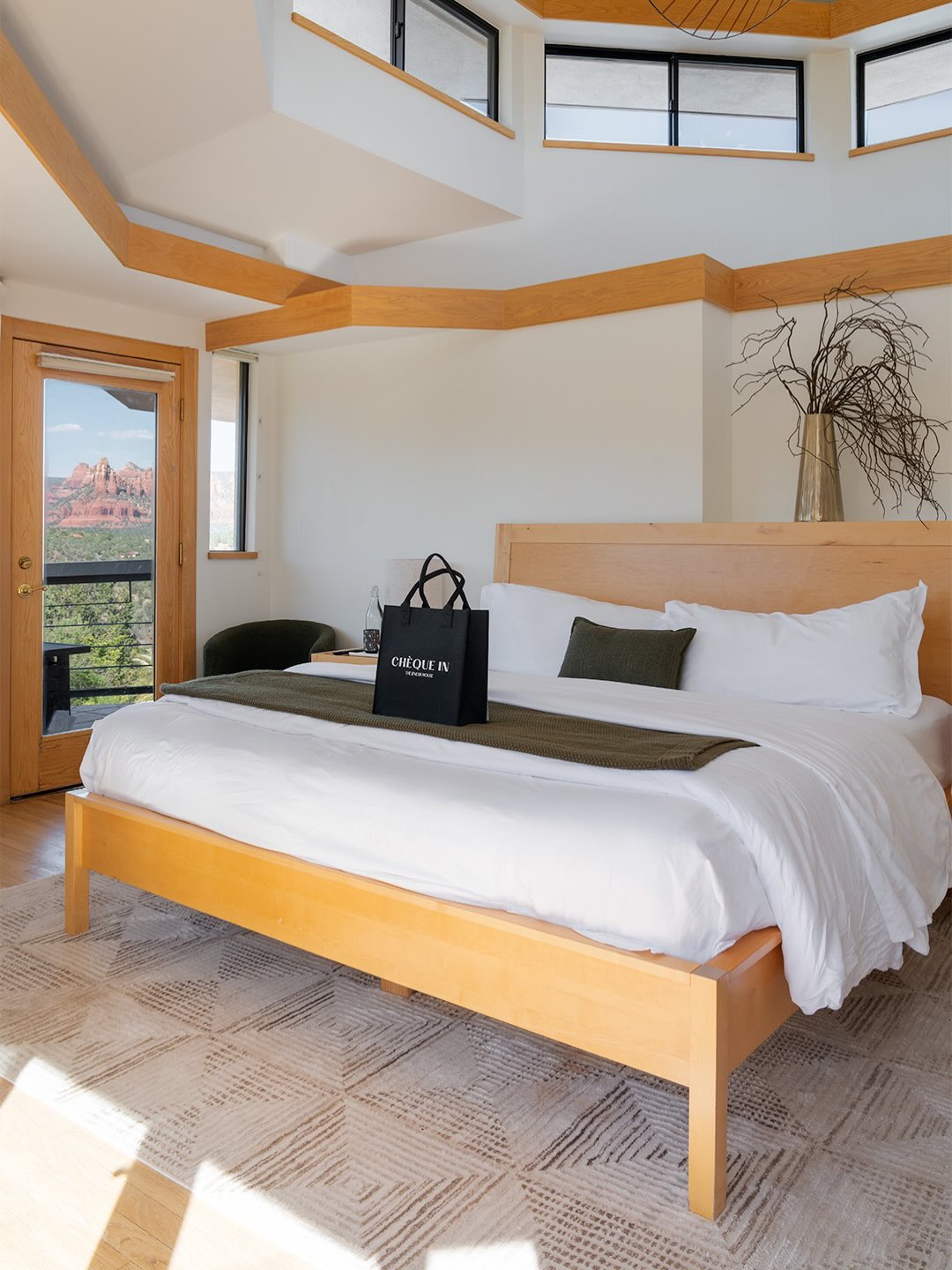 Wake up surrounded by Sedona’s red rocks and endless desert sky.
The Moon Suite, located on the second floor of our Tea House, offers elevated views of the estate, saltwater pool, and surrounding mountains. Step onto your private balcony for quiet sunrise moments, glowing sunsets, and peaceful evenings beneath the moonlight.
Inside, soft natural textures and minimalist design create a calming atmosphere for rest and reflection. A modern standing shower offers the perfect reset after a full day of wellness rituals.
This is where you slow down.
This is where you return to yourself.
Ready to experience The Jenesis House?
Visit TheJenesisHouse.com and select Book Now. 🖤