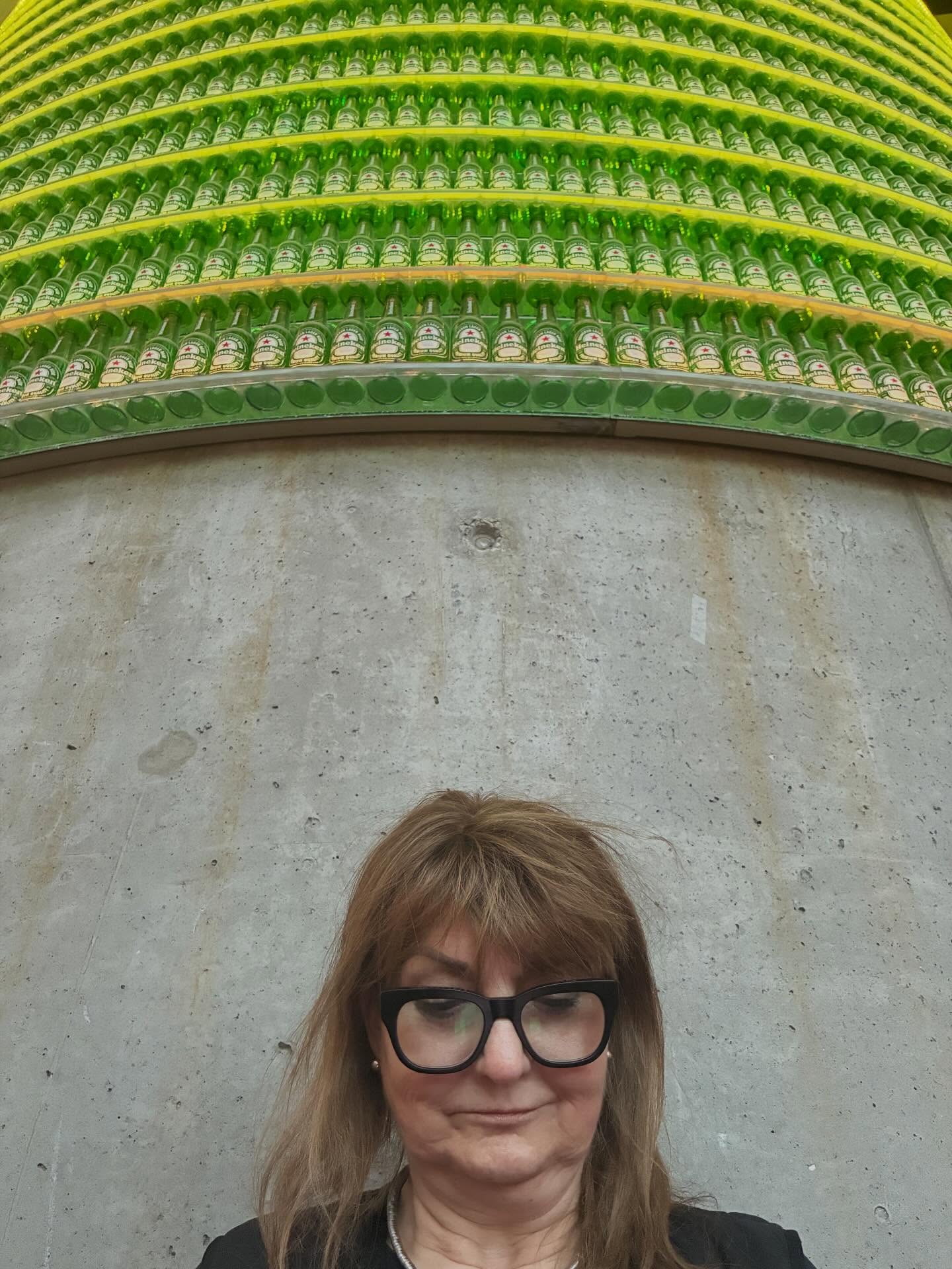 The drinking age in Denmark is 16, and public alcohol consumption is allowed. Though we have not seen anyone fall down drunk, we found where they been tacking their bottles. That’s a wall of empty Heineken’s above Kati on the central support column in the building.