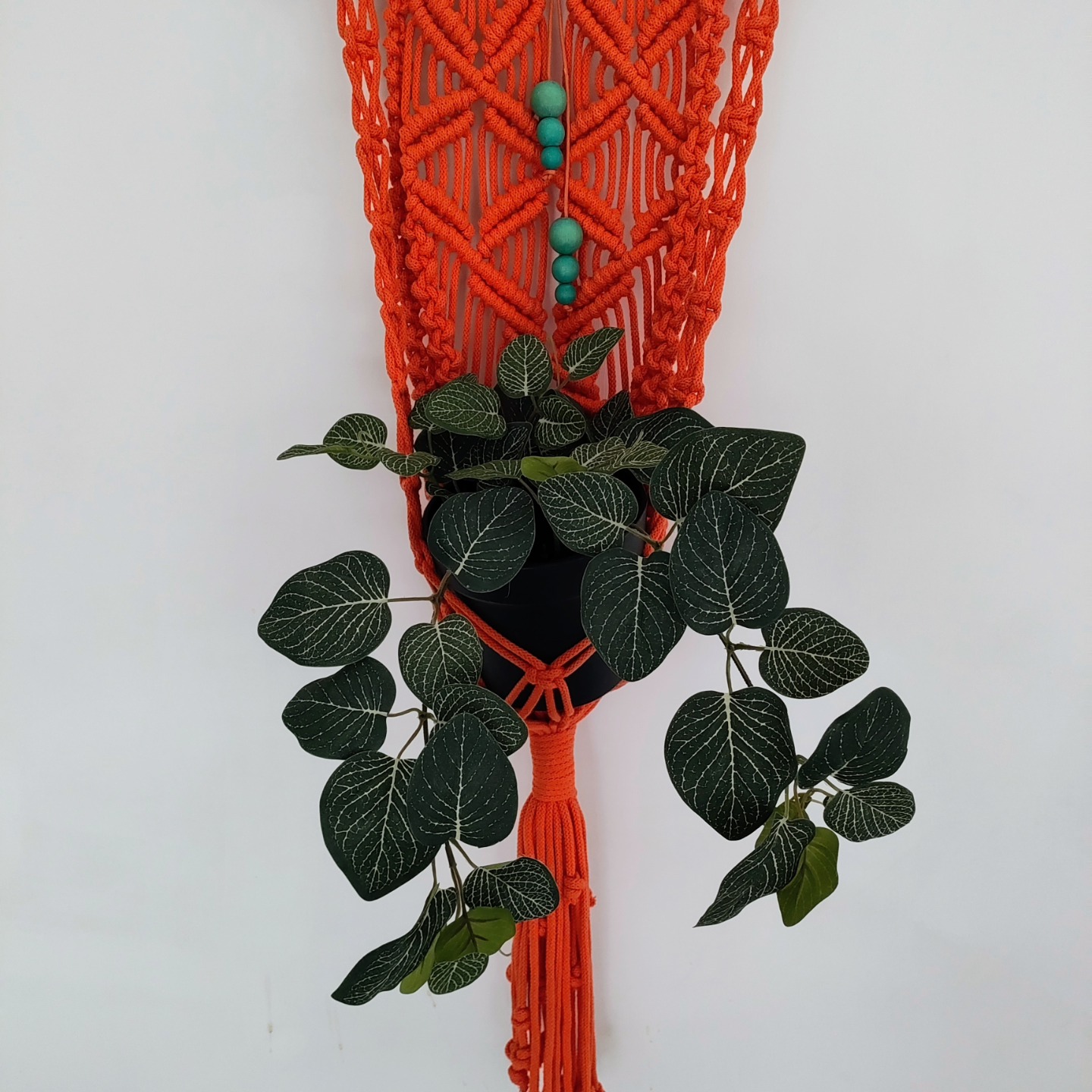 'Orange and Turquoise' - Macrame plant pot holder made of vibrant orange braided recycled cotton cords and embellished with turquoise wooden beading. 900mm x 200mm
karenmorganart.com
info@karenmorganart.com
#plants #texturalart #interiordecor #macramé #wallart