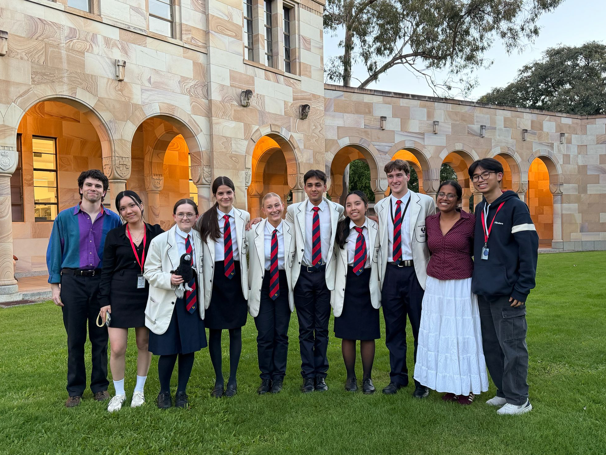 After winning minor semifinal against the Australian Capital Territory in the morning, negating "That we would prioritise native title claims over financial compensation as the primary form of reparations to Indigenous peoples", the Shrikes came into preliminary final on the negative bench of the motion "That we support students in Australian schools learning the most commonly spoken second language in their local government area". They ultimately bowed out to Queensland and officially finished third in the 2026 National Schools' Debating Championship.
We are proud beyond words of the Piping Shrikes for the countless hours of hard work they have put in over the past 4 months, the myriad of high-level debating demonstrations over the past week, and their incredible achievements in the tournament.
We thank Queensland Debating Union for hosting the 2026 NSDC and the Shrikes' parents for supporting them on their journey, many of whom flew over to Brisbane to watch the Shrikes debate. We further extend our gratitude to those who accompanied the Shrikes to NSDC: Kyan Jenkins who attended both as their coach and as South Australia's Official Adjudicator, Sokun Flinders Thorn as their coach, Niya Singhal in a supervisory role, and Colette Le as South Australia's Unofficial Adjudicator. Finally, we are again immensely grateful to the Shrikes - Gigi, Grace, Ansh, Harry, Bella and Evie - for letting us bear witness to their brilliance, and to the State Team coaches - Kyan Jenkins, Max Thomas, Devika Kuah, Evelyn Vincin Walker and Sokun Flinders Thorn - for their mentoring.