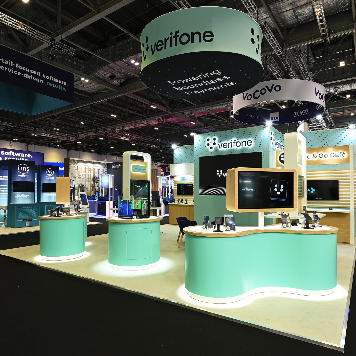 Next up: it's the unmistakable mint green brand colours of retail point-of-sale electronic payment machine and services provider Verifone. 🟢
A brand for whom we regularly designed and built stands throughout the 2010s at shows like Apps World, Ecommerce Expo and Card & Payment Solutions, this is our second time delivering for them at @retail.technology.show after they returned to us last year. 👷🏻♂️
In exhibition stand design, it's the little details that effectively reinforce and communicate brand identity - in this case, the counters imitate the keypad buttons and infinity shape within the Verifone logo.
The curved faces also reflect a high-end ergonomic feel, with their angled positioning nicely framing the edges of the stand, creating a semi-private internal area for delegate discussion and networking. 🗣️🫱🏻🫲🏻
#retailtechnologyshow #rts #event #exhibition #london #design