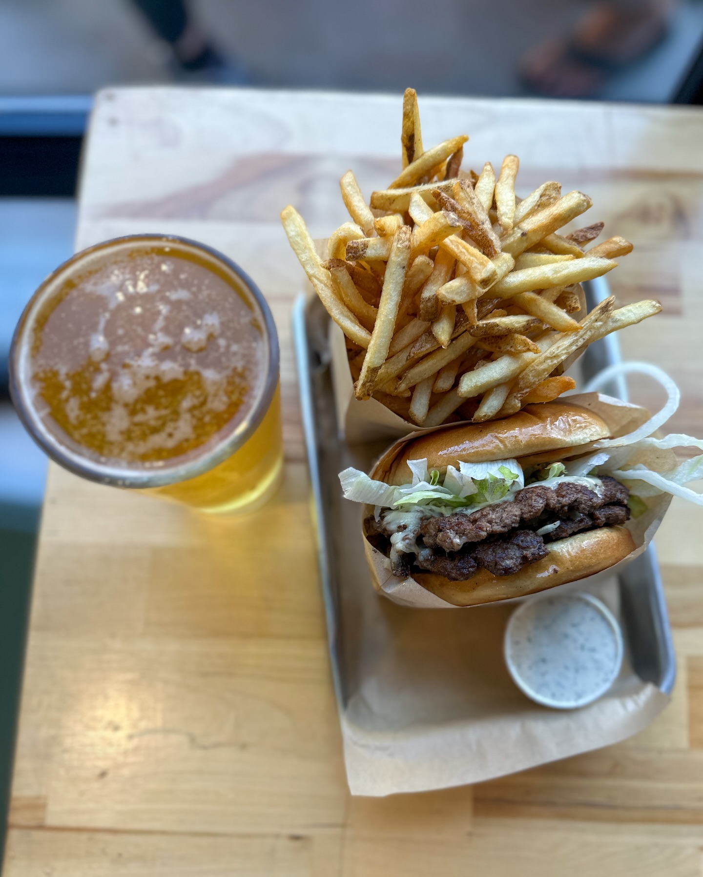 This is your sign.
$11 burger + draft beer every Tuesday for Neighborhood Night.