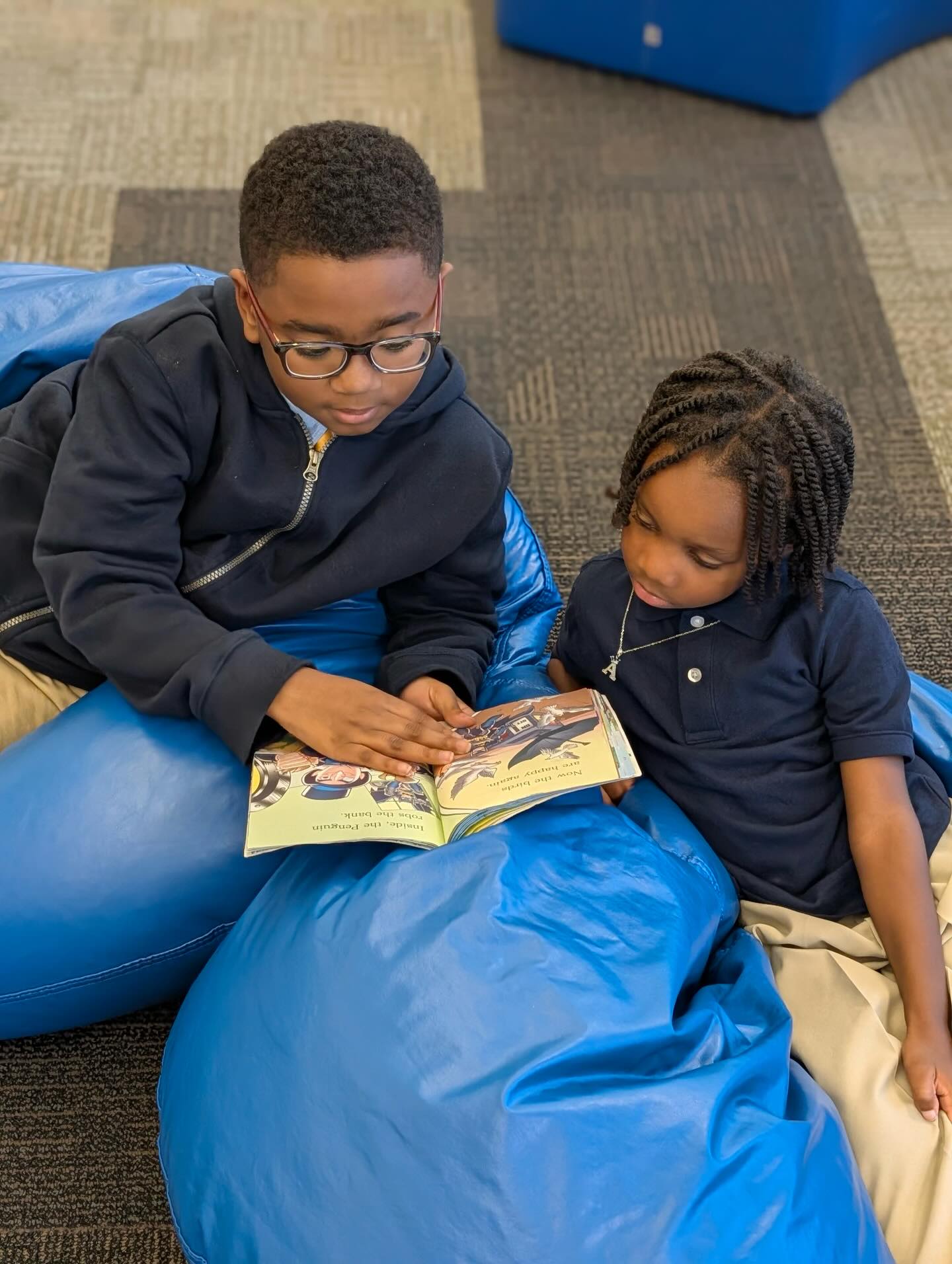 Big brothers in action.
5th graders reading with our youngest kings.📖