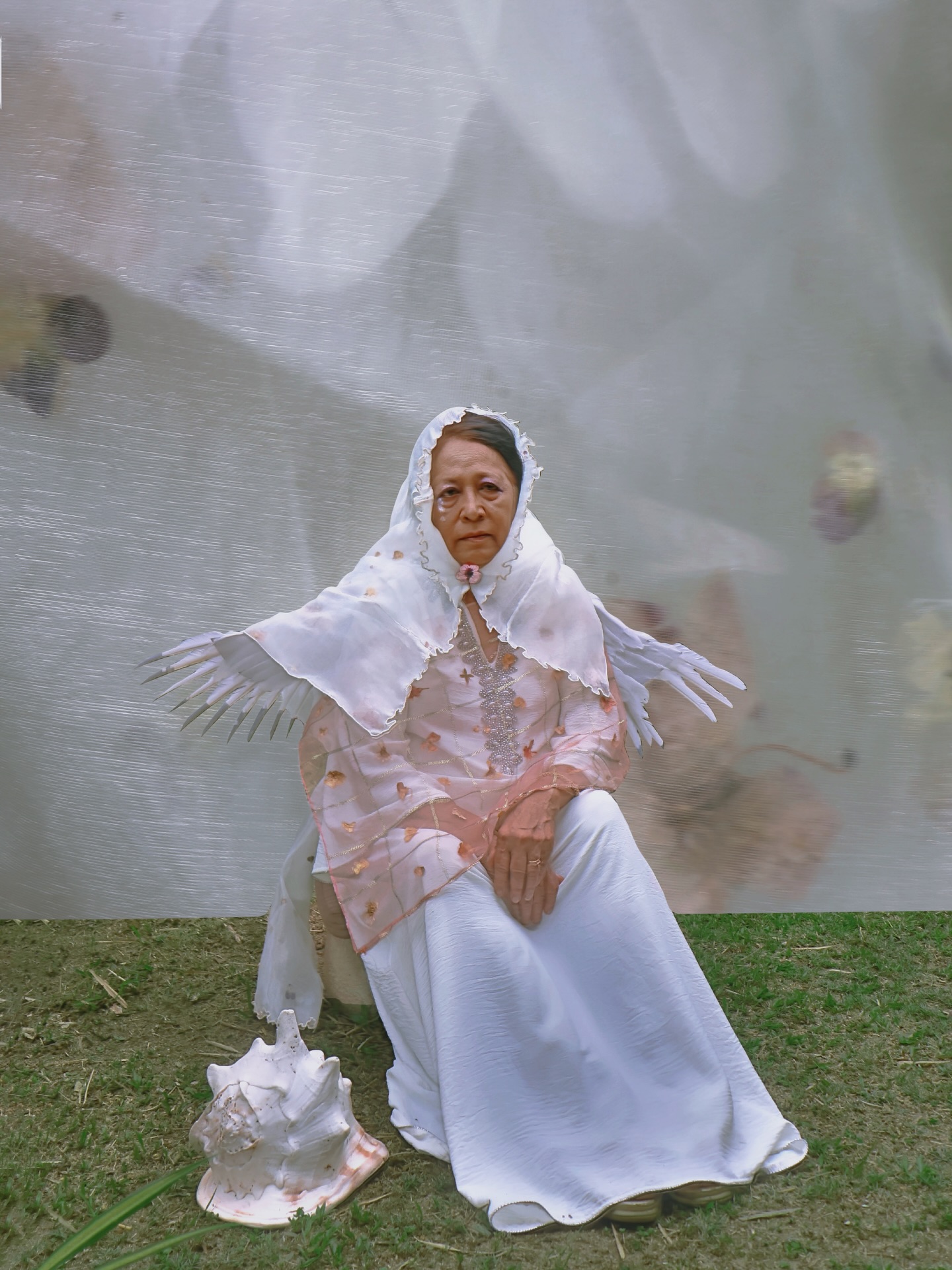 Mak,
Brought my granny puff into my world, a language iโm more fasih and equipped with, the best way that I know how to kenal,
been reorienting myself in ways I canโt susun into words to comprehend, now my head toleh to watch the ephemeral process of women and becoming,
maybe from learning about myself more or just growing older, mungkin even another form to feel my late mother again in stories that paint her before the pictures I have of her and to kenal becomes something different again.
niyaat # 01
handsewn baju kurung, pressed orchids and local flowers encased in three layers of organza.