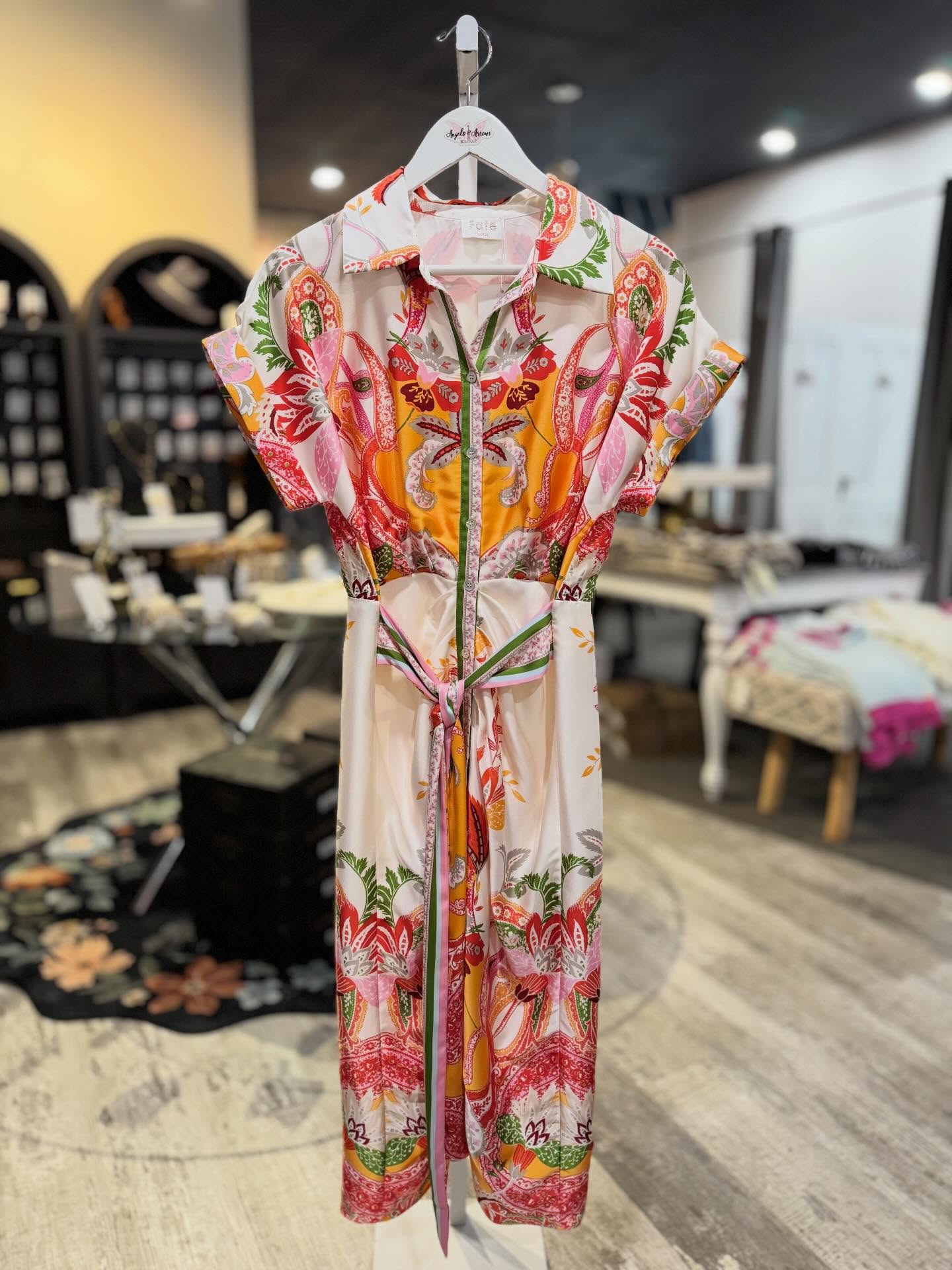 This dress is vibrant! It feels so luxe with its silky drape and tied waist. Style it with a white strappy flat or a heel for an elongated & elevated look! Accessorize with a wristlet, hair clip, and statement earrings.