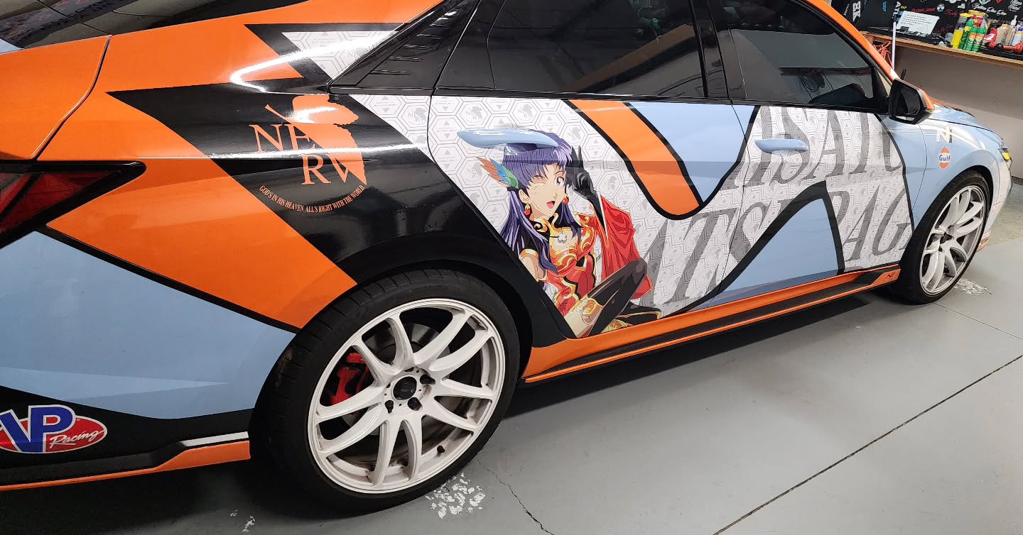 The vehicle combines the iconic gulf racing livery theme with anime inspired itasha styling, blending classic motorsports heritage with modern Japanese car culture. Featuring the signature light blue and orange gulf color scheme, the design is enhanced with bold anime character artwork integrated throughout the body panels while still maintaining the clean racing anesthetics. The mix sponsor style graphics racing stripes, and vibrant anime visuals creates a unique show car appearance that stands out both at automotive events and on the streets.
.
.
.
#jdm #itasha #gulfracing #gulf #2tone #anime #orange #lightblue #lawrenceville #atlanta #georgia #livery #theme #racingstripes #hyundai #elentra #n #kdm #nperformance