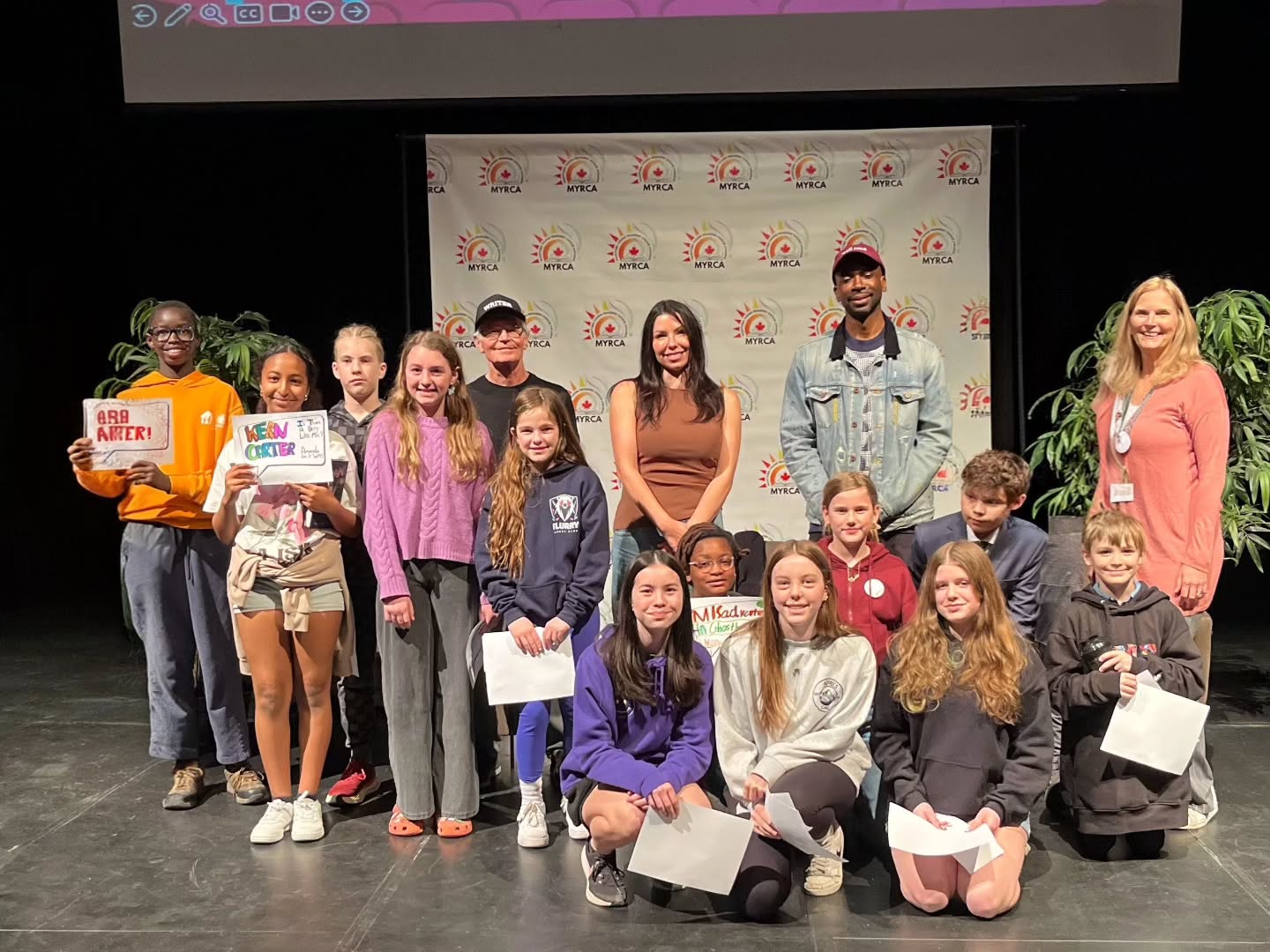 MYRCA Celebration. Recently, students from all over the province participated in the "Manitoba Young Readers Choice Awards." Over 50 schools had the honor of participating in the event live. 13 students from the Bedson campus were able to attend. They got to meet the authors, hear about their writing processes, and find out first which authors had won. David Osario, a grde 6 student, was one of the MCs for the event.