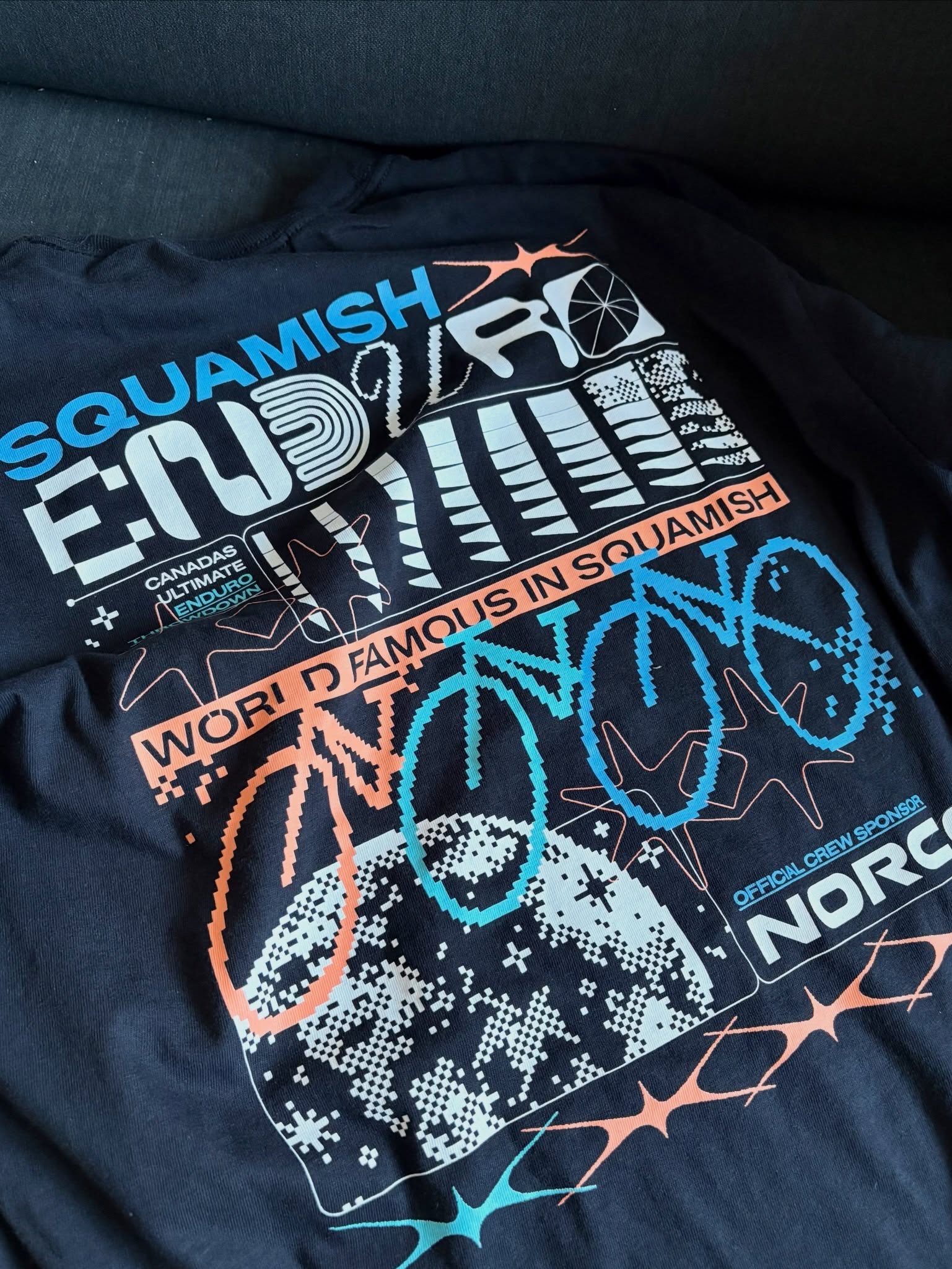 Supporting the people that support the people 👊 - @norcobicycles is the Official Crew Sponsor of the 2026 Squamish Enduro.
Norco is headquartered in our backyard, in Vancouver BC, and has been there since 1964. A family owned Canadian company, guided by some of the best people you will ever meet. 🇨🇦
Norco has stepped up huge this year to hook up all the 130+ volunteers and crew who make the Squamish Enduro come alive. All of the support crew get a commemorative Norco thank you package with a limited edition tee, hat, socks, and a bio-plastic water bottle.
In addition, Norco will be up at the top of Perth Drive handing out hot dogs and beverages courtesy of @nestersmarket to racers and spectators. Head up there to give them some props and catch the action on the Full Course at the bottom of Roller Coaster. Remember eyes up the trail 👀.
Norco worked with @nicolehall.ca to design this year’s limited edition graphic which appears across a number of pieces including the @howesoundbrewing Soeed Zone cans, race plates, and @andrewwatsondesign awards and trophies.