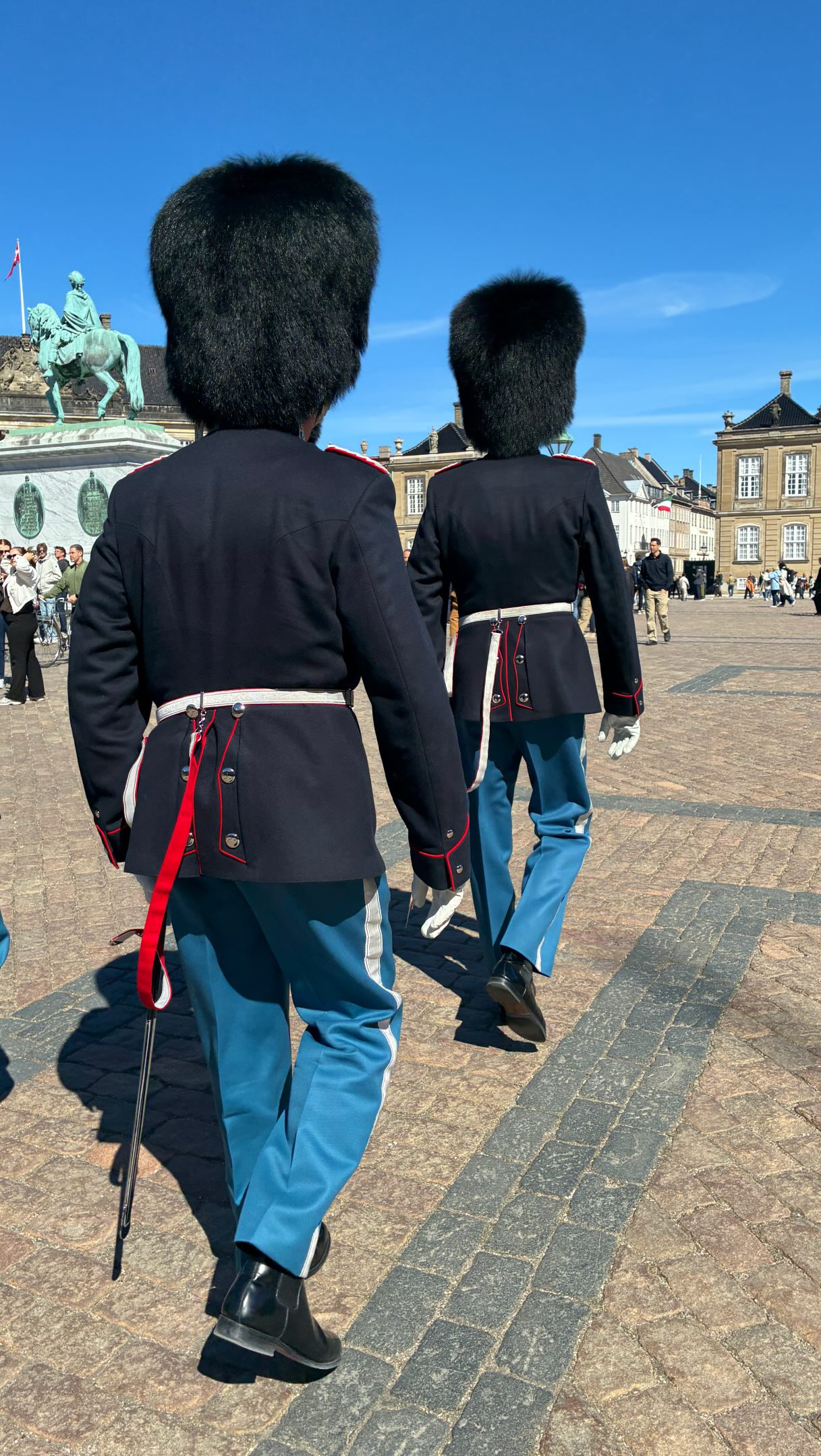 The Danish Royal Guard march daily at 11:30 from Rosenborg Castle to the Amalienborg Palace just down the road before the changing of the guard. When the Royals band is playing it means the King is in residence at the palace. For inquiring minds, both men and women are guards and they carry Colt C7 (or C8) rifles with 9 round magazines and spare 30 round mags.