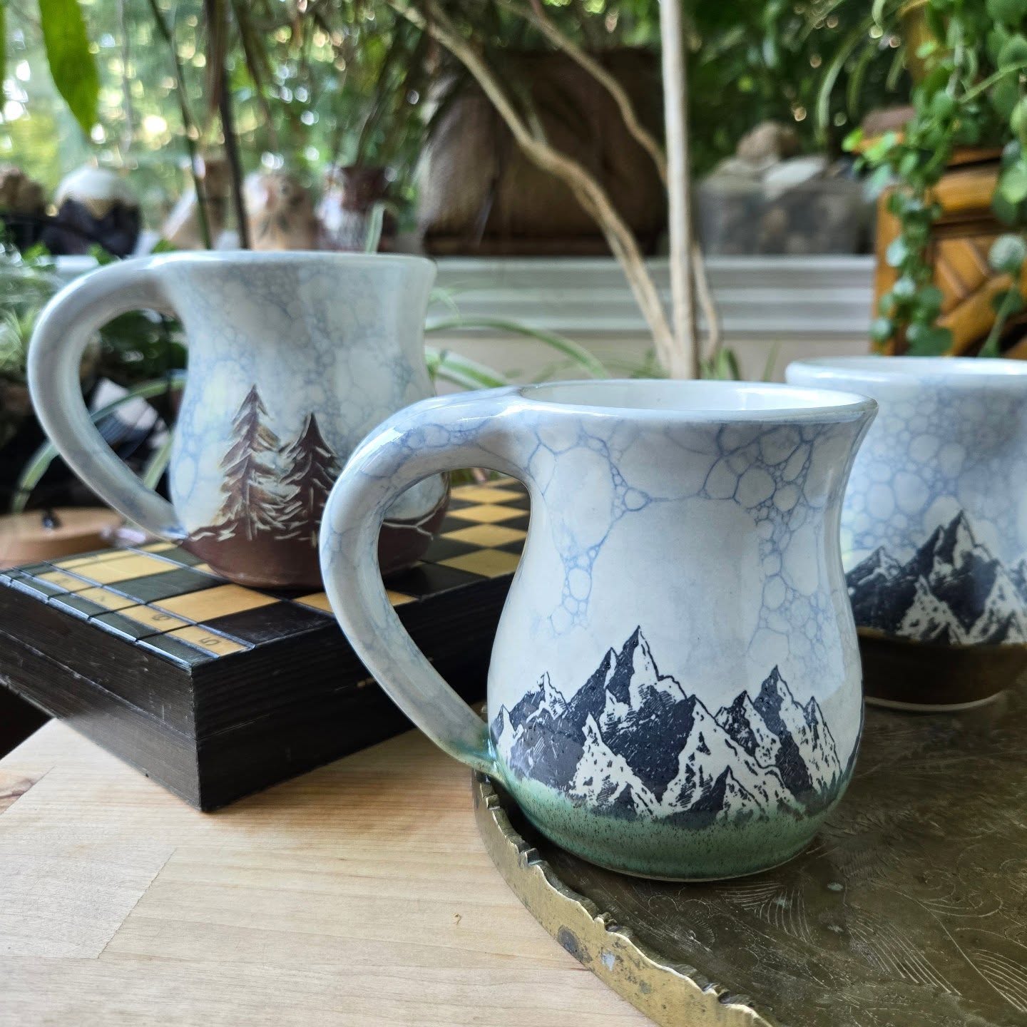 My Scenery/Bubble mugs are back! My table @pikeplacepublicmarket will be open on Sunday, May 3rd, 9:30-4:30. If you have time to come over, you'll meet my sons who will be selling for me 👋🏼
.
.
.
#ornapottery #pikeplacemarket #mothersdaygift #handmadepottery