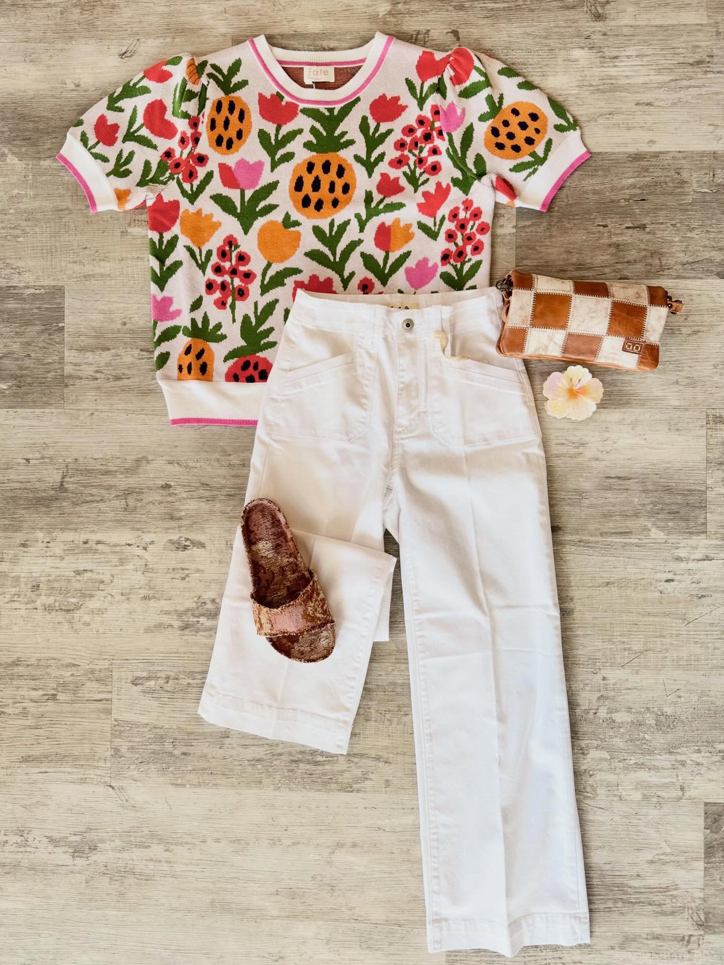 Three bright, bold, floral looks with one white denim @charliebcollection base. 🌺 Each look is accessorized with one of our new hibiscus claw clips, a checkered @bedstu convertible crossbody, and @freepeople slides.