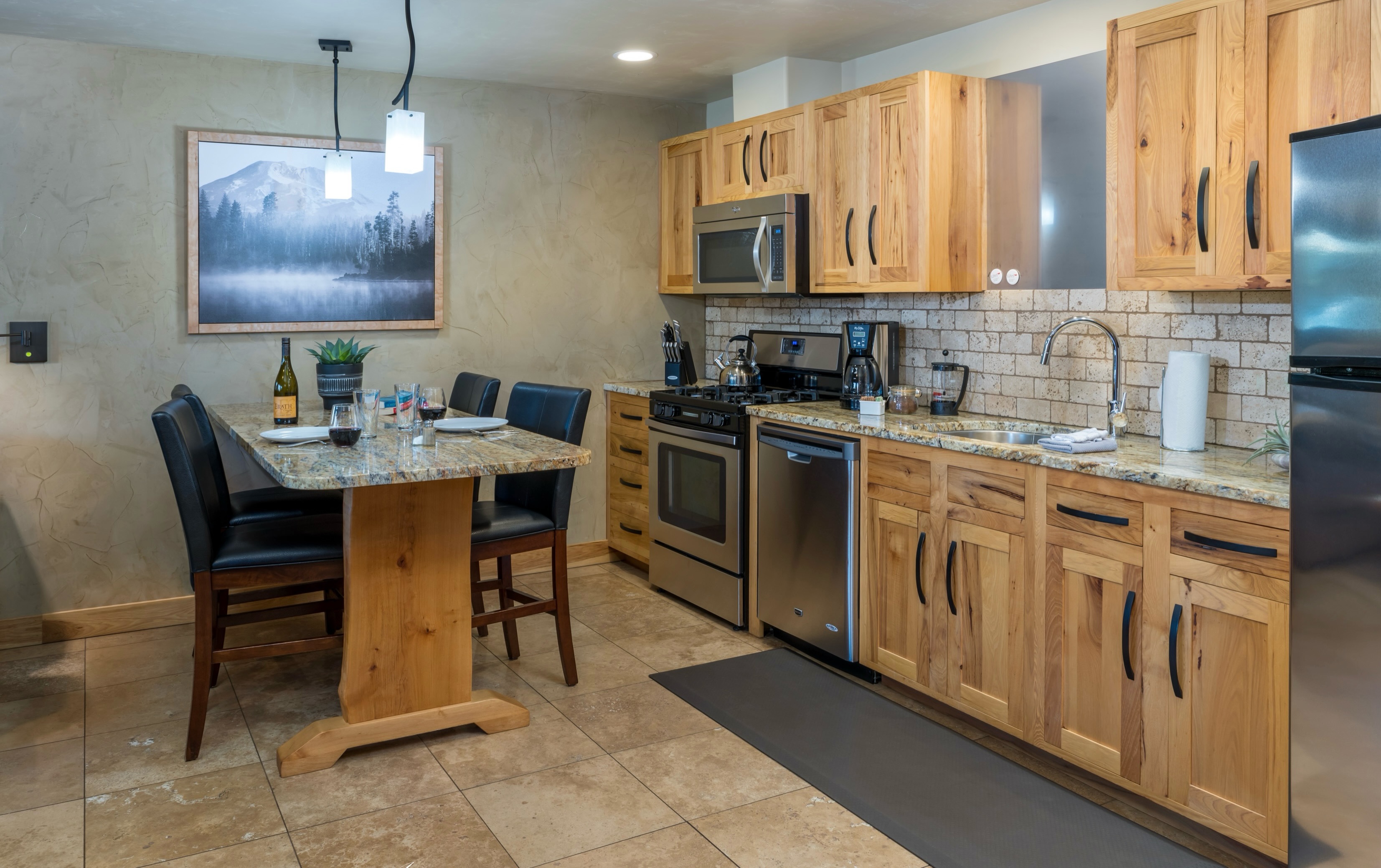 Experience the comfort of home with the luxury of a getaway at Wall Street Suites in Downtown Bend. Each suite features a fully equipped kitchen, giving you the freedom to dine in, entertain, and settle in at your own pace—just steps from the best of Bend. #wallstreetsuitesbendoregon #centraloregon downtownbend #dogfriendlyhotel