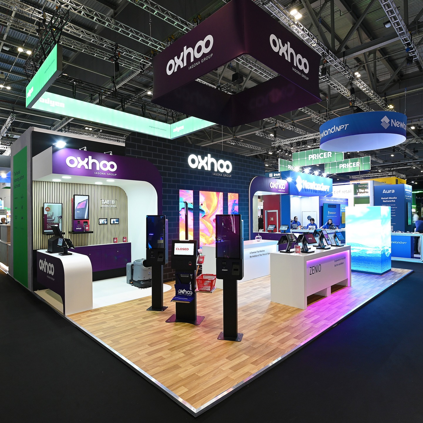Another returning client for us at @retail.technology.show, we were loving @oxhoouk 's stand design, with its on brand dark and regal purple tones, which sat nicely against the white laminate, natural acupanel and oak vinyl floor. Additional curves and recessed LED strip lights really enhanced the bespoke, polished feel.
The most striking feature of this stand however was the fantastic audiovisual totem and accompanying moving images, providing a dynamic point of interest to draw in footfall from the aisles and help the exhibitor stand out from their competitors.
Something we were strongly remined of at retail technology this year though: never underestimate the complexities of handling and storing a great deal of client product and empties onsite 😅
#rts #retailtechnology #LED #retailPOS #exhibitions #events #b2b #livemarketing