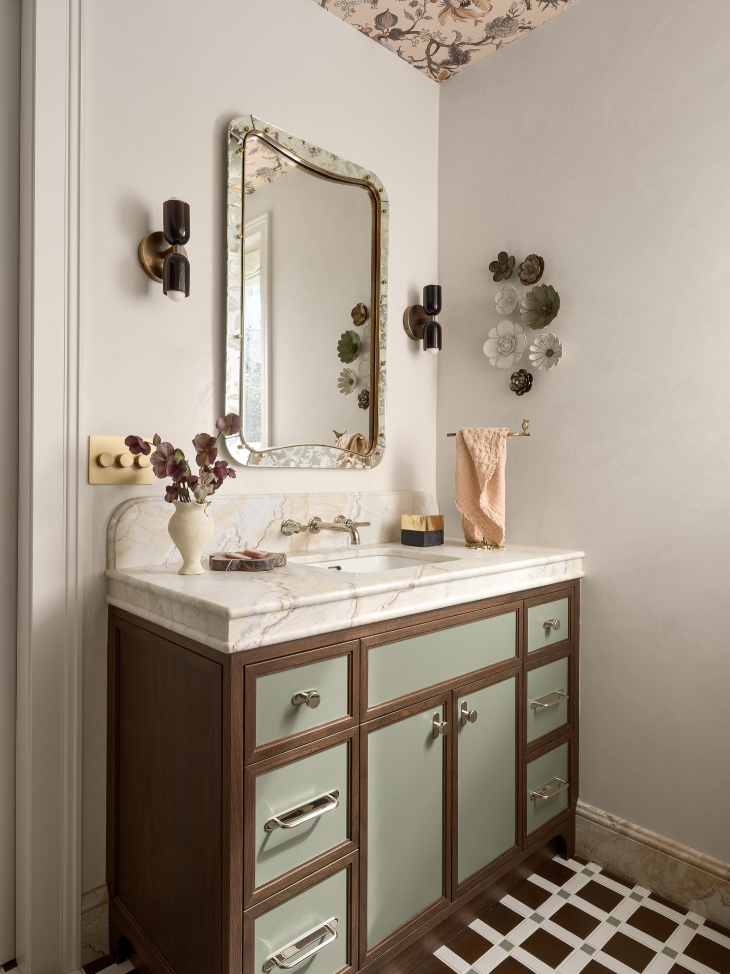 A study in detail, craftsmanship, and quiet beauty.
This vanity—handcrafted by @gammadesigns —anchors the space with character and warmth, its rich wood framing soft sage panels that feel both classic and fresh. Topped with stunning stone from @davincimarble and expertly fabricated and installed by @aguilartile , the surface becomes a canvas for daily rituals, complemented by taps by @kallistadesign in polished nickel for a timeless appeal.
Underfoot, the graphic rhythm of floor tile by @mcintyretile grounds the room, while delicate ceramic blooms by @anastasiatumanova_ add a poetic, sculptural layer to the walls.
Lime Smooth plaster by @coloratelier —meticulously applied by @aacdesignca —introduces depth and softness, drawing the eye upward to a ceiling clad in @houseofhackney .
Every element working in harmony—layered, intentional, and deeply considered.
Design: @sonomainteriors
Build: @dotto_company
Photography: @tim.d.coy.photography
Styling: @lucybamman
#BirdsOfAFeather #SFDecoratorShowcase #SonomaInteriors #InteriorDesign #DesignDetails