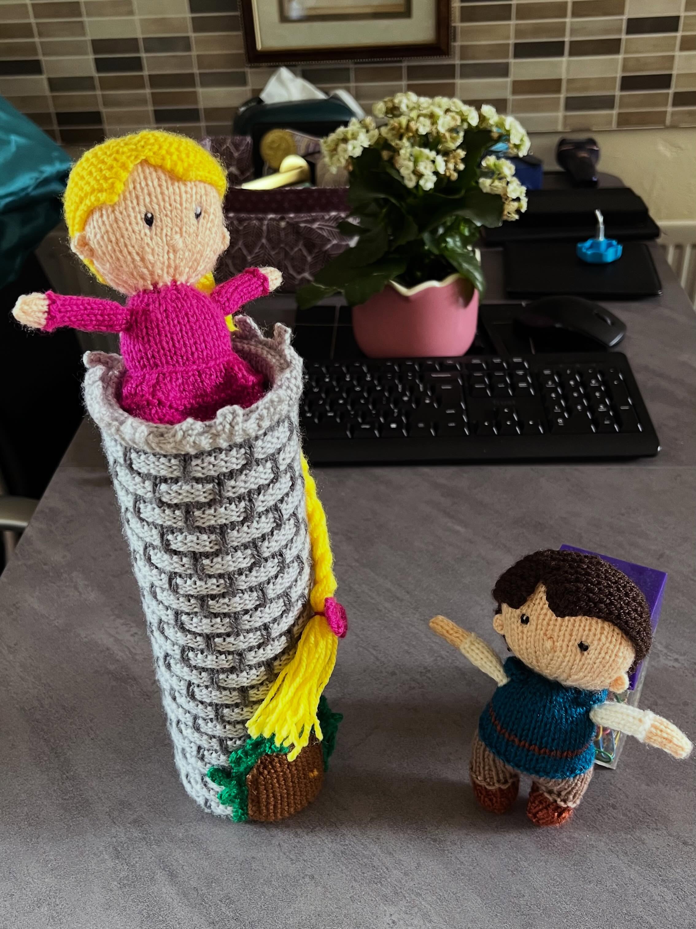 Rapunzel, Rapunzel, let down your yarn
An amazing pattern I got just before Christmas from the collection Pantomime Heroes by Amanda Berry. Slightly adapted to make a taller tower and for the ‘prince’ to match the film rather than the panto. A great mix of common and unique techniques so you can really see your skills developing as you go.
Ravelry Pattern: https://ravel.me/rapunzel-pantomime-dolls