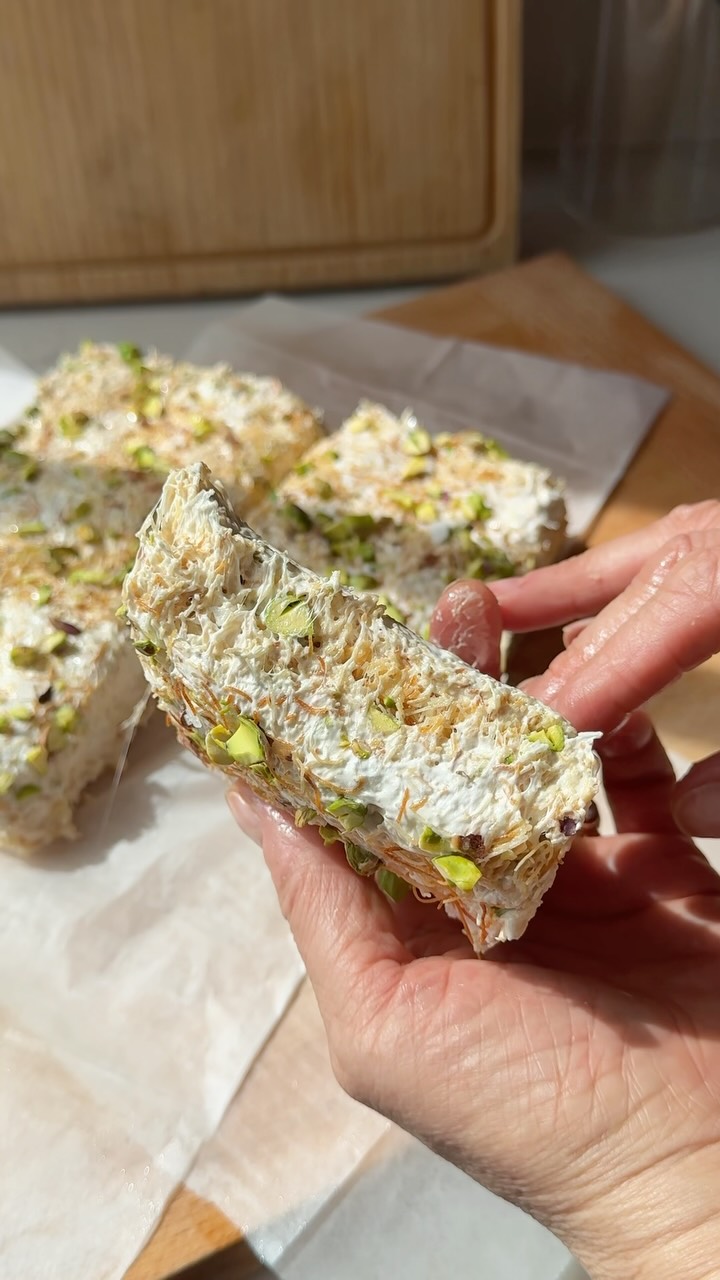 KADAIF MARSHMALLOW CRISPY TREATS
I’m in my crispy treat era! (Exhibit A: my Bamba version in Zariz). This rendition uses kadaif, the crispy shredded phyllo more typically seen in knafeh desserts. I toast the kadaif (it’s usually bought frozen, so make sure you defrost it overnight) for extra crunch factor, then use the same method to melt the ‘mallows with butter (use coconut oil or plant butter to make these dairy-free). The optional orange flower or rose water is a beautiful touch, the salt is essential, and you can never go wrong with gorgeous green pistachios for nuttiness and visual appeal!
Makes 16 squares
a one-pound package kadaif (shredded filo pastry), defrosted if frozen
5 tablespoons (65 grams) butter or coconut oil, plus more for greasing your hands
a one-pound (450 grams) package regular or mini marshmallows
1 drop orange flower water (or rose water, optional)
½ teaspoon flaky sea salt, + more for garnish
¾ cup roasted & salted shelled pistachios, roughly chopped, plus 2 tablespoons for garnish
Preheat oven to 400°F. Open the package of kadaif and place it in a large bowl. Use your hands to gently untangle and fluff the kadaif to separate it until there are no clumps (you should have around 12 cups). Arrange in a single layer on a large rimmed baking sheet. Bake until deeply golden and crisp, rotating once if necessary, 20 minutes. Line an 8-inch square baking pan with parchment. Melt butter in a large (at least 8-quart) pot over low heat. Add marshmallows; warm, stirring, until just melted, 3 - 4 minutes. Stir in orange flower water; remove from the heat. Working quickly, stir in all but 2 tablespoons of the kadaif, with the pistachios, and salt until fully coated. Quickly transfer to the prepared pan. Sprinkle evenly with the reserved 2 TB each kadaif & pistachios & some flaky salt. Cool slightly. Use greased hands to press the mixture down to even & fill out the pan. Lift out with the parchment onto a cutting board. Using a lightly oiled knife, cut into 16 equal-sized squares. Store in an airtight container for up to 1 week. If desired, soften slightly in microwave for 5 to 10 seconds before serving.