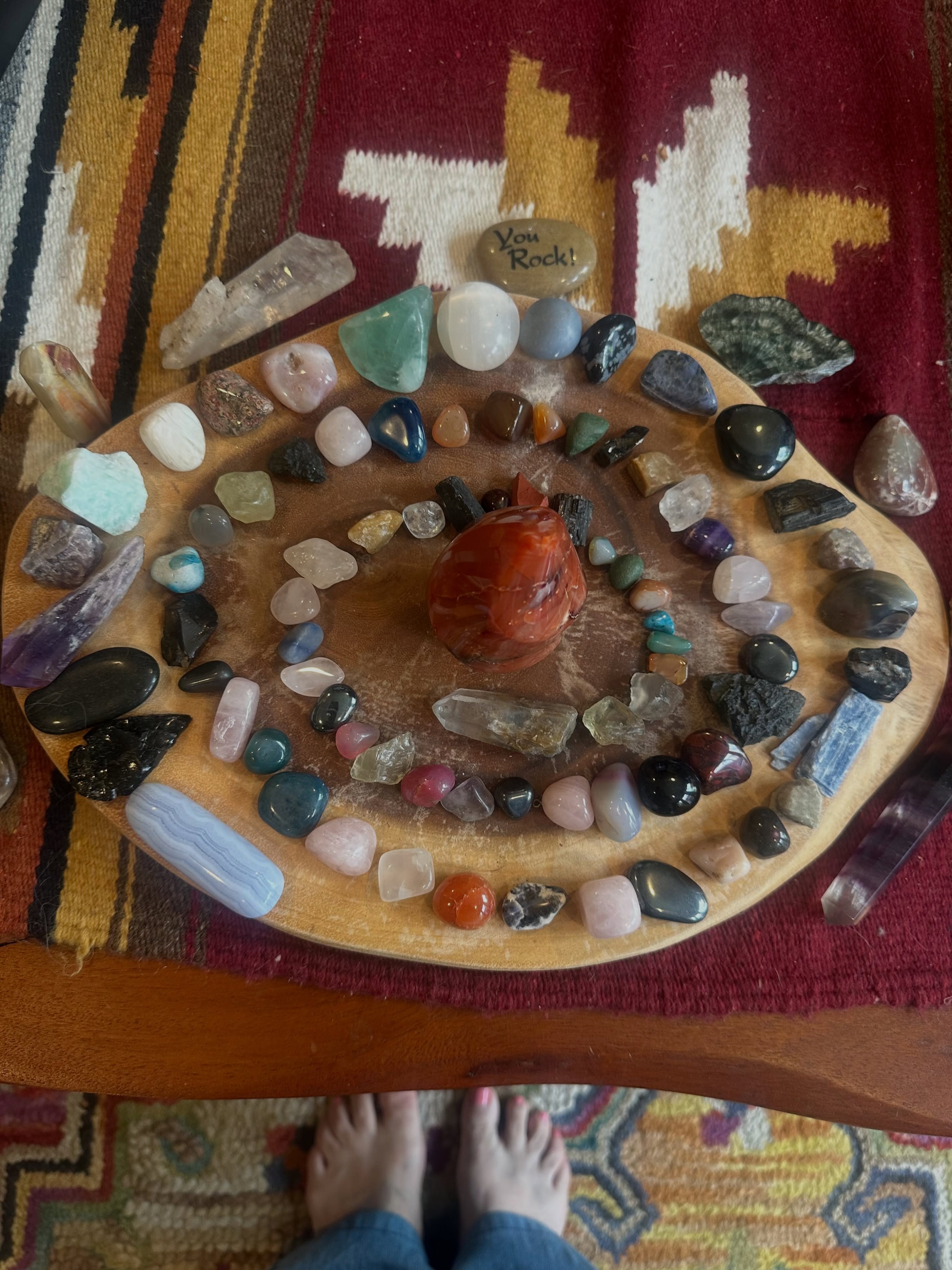 The spiral shape itself is considered symbolic of movement and expansion. When crystals are arranged in a spiral it draws energy inward towards the center point. Then radiates energy outward. It helps to amplify intentions. I did this more as a creative way to work with my smaller crystals.