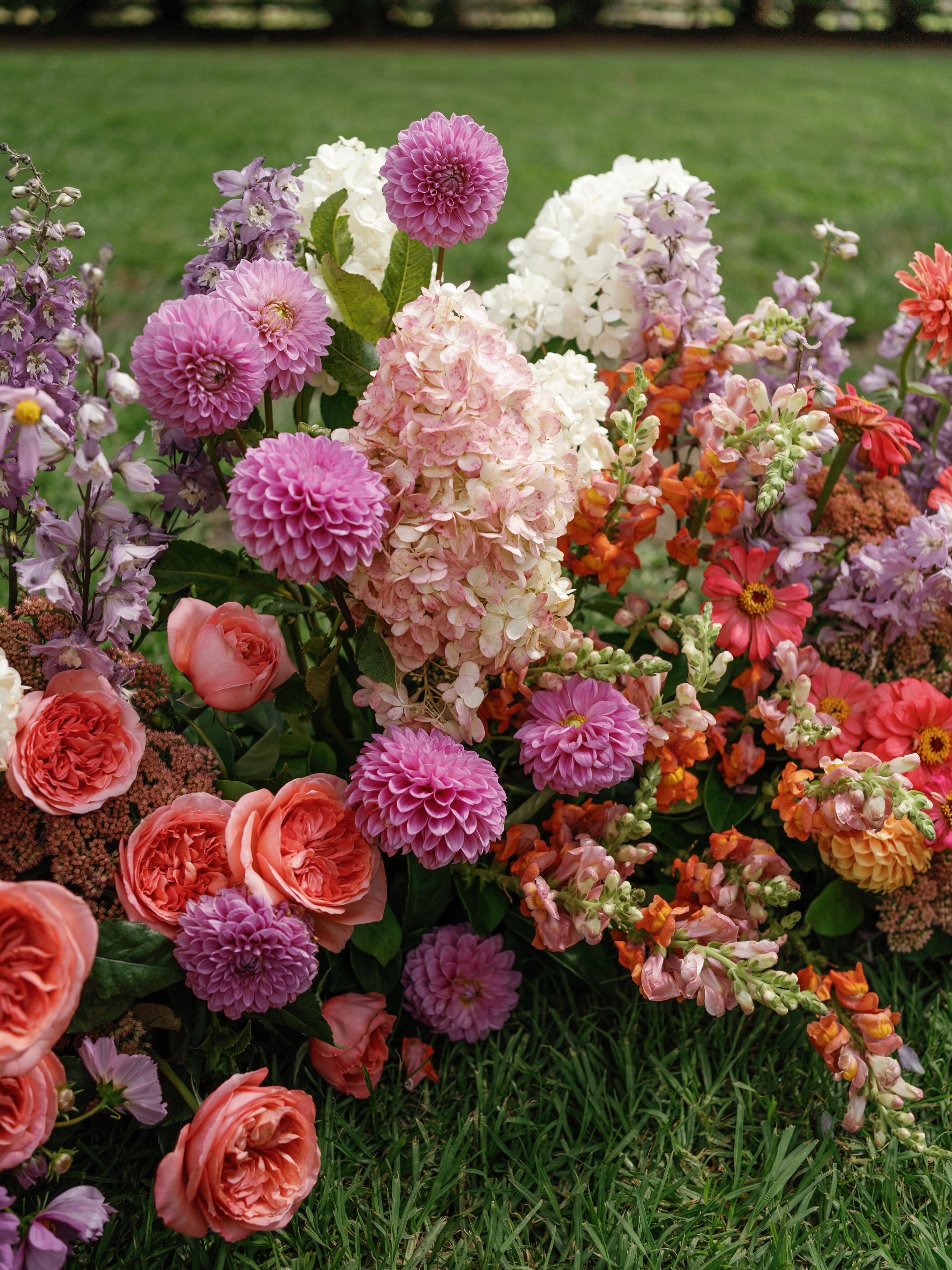 Texture and tone and masses of blooms. Designing wedding flowers isn’t just chucking some pretty flowers together.
It’s making sure the yellow centre of the cosmo daisy, is complemented by the lemon of the roses. The slight mauve undertone of the dahlia, is enhanced by the lilac of the delphinium. The fluffiness of the hydrangea is accented by the structured petals of the zinnia. It might seem like lots of pretty flowers, but every bloom is considered. It’s one of my favorite parts of the job.