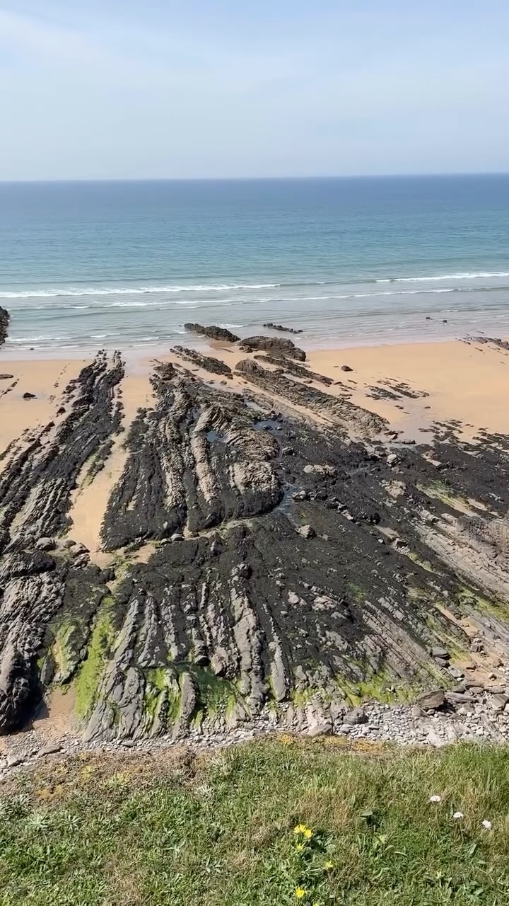 Structural geology heaven at Northcott Mouth at the top of Cornwall.
A series of large-scale upright anticline and syncline folds are exposed in the foreshore here, elucidating impressive deformation of these Carboniferous during the Variscan Orogeny.
The fact the trace of bedding appears to create these massive zigzag shapes in the horizontal foreshore platform tells us the fold hinges are plunging.
Because the fold limbs of the anticlines converge and the syncline fold limbs diverge in a westerly (seaward) direction these folds are plunging towards the west.
You can also make out different fold hinge geometries as well meaning there must be different strain rates and rheological contrasts in the rocks as well.
I feel a geology doodle coming on for this place. Keep an eye out for more posts on this amazing location!
#cornwall #geology #structuralgeology #geologist #geologyrocks