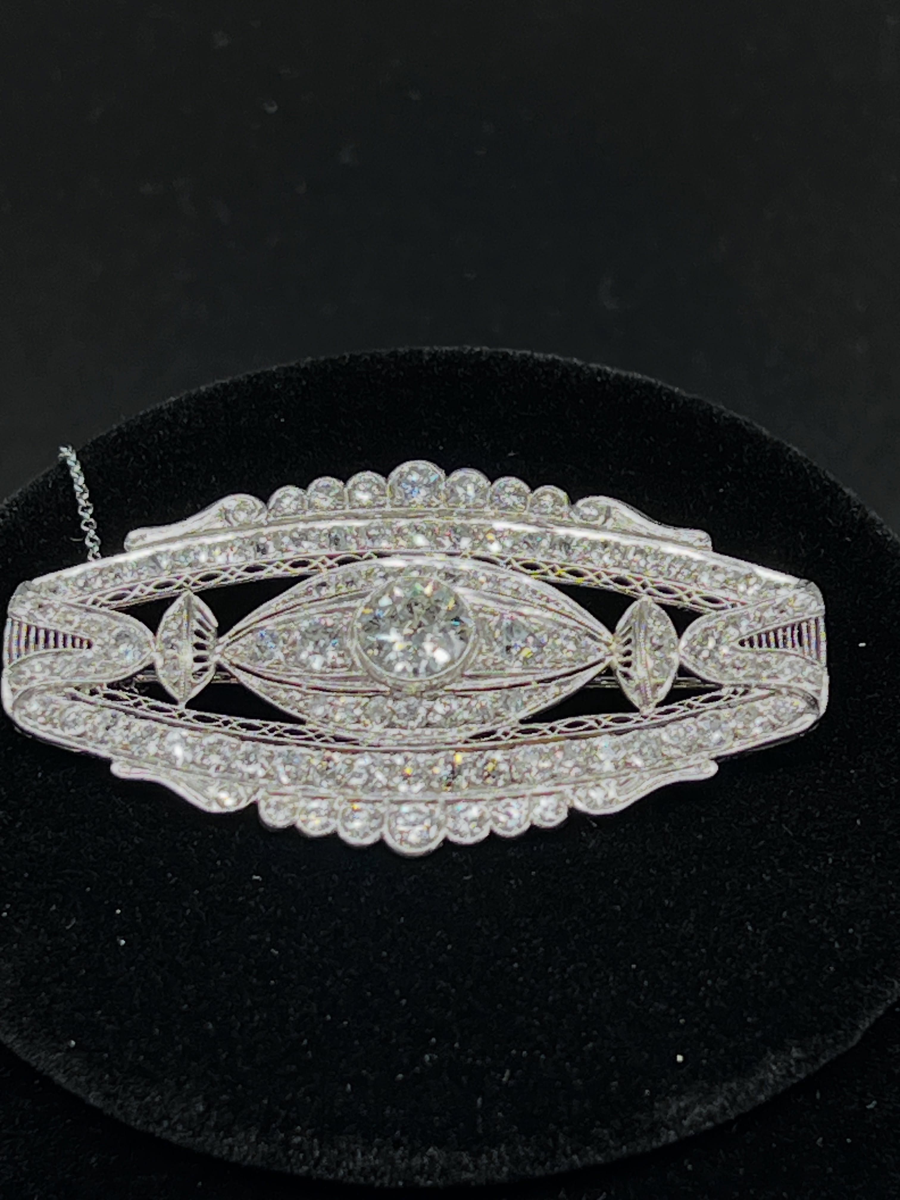 A beautifully preserved late Edwardian diamond brooch dating to circa 1910.
Hand fabricated in platinum and white gold, the brooch is centred by an old European cut diamond of approximately 1.58 carats and framed by intricate pierced openwork and fine diamond-set detailing throughout.
Elegant, light, and remarkably refined — a piece that captures the grace and craftsmanship of the Edwardian period.
Available for private viewing by appointment only.