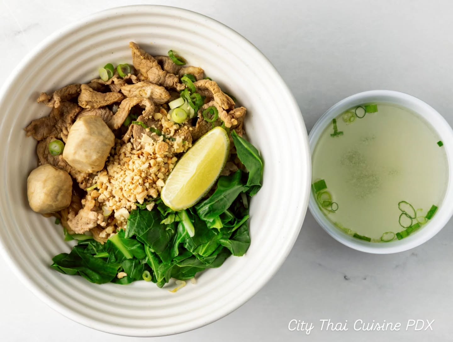 GUAY TIEW HANG (Thai-style dry noodles)
Thai-style dry version of thin rice noodles with pork, pork balls, bean sprout, Chinese broccoli, onion, ground peanut, lime. Served with house soup on the side.
YUM!!!
Only @citythaipdx
#citythaipdx #pdxeats #pdxfoodie #thairestaurant #hillsdale