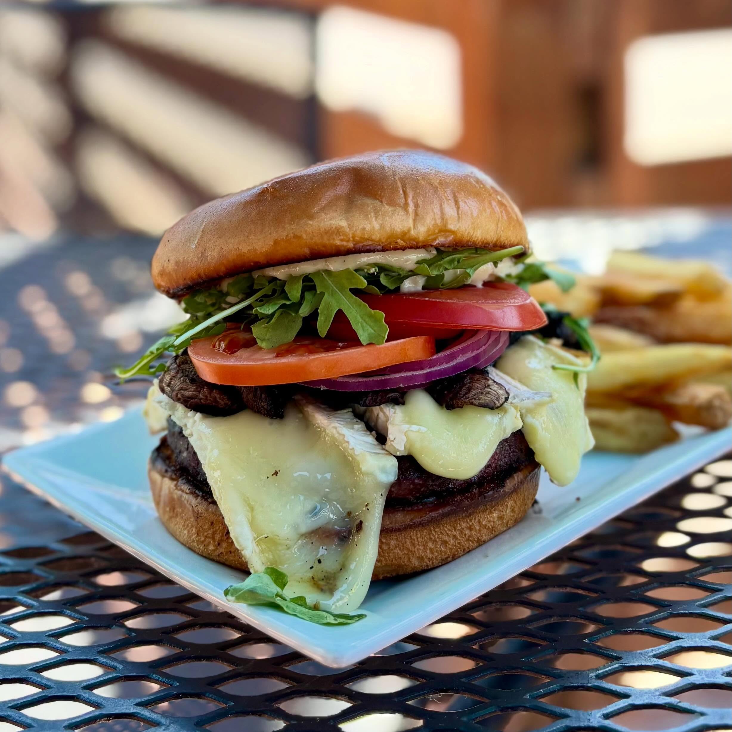 We’re gonna let the Specialty Burger have the spotlight on the socials this week! 🍔🍄🟫
-
Weekly Specials: May 11 - May 16
-
Lunch Special: Mushroom Chicken Sandwich
Grilled chicken breast topped with sauteed garlic crimini mushroom, caramelized onions, Swiss cheese, arugula, and creole remoulade on a toasted ciabatta
-
Daily Soup: Mushroom vegetable and rice
Vegetarian and gluten free
-
Specialty Burger: The Porto Burger
Grilled beef patty topped with brie cheese, grilled portobello mushrooms, red onion, tomatoes, arugula, and a black pepper-truffle aioli on a toasted bun
-
Birch Salmon: The Wild One
Crimini mushroom and herb seasoned salmon, pan seared served with a warm wild mushroom and barley salad