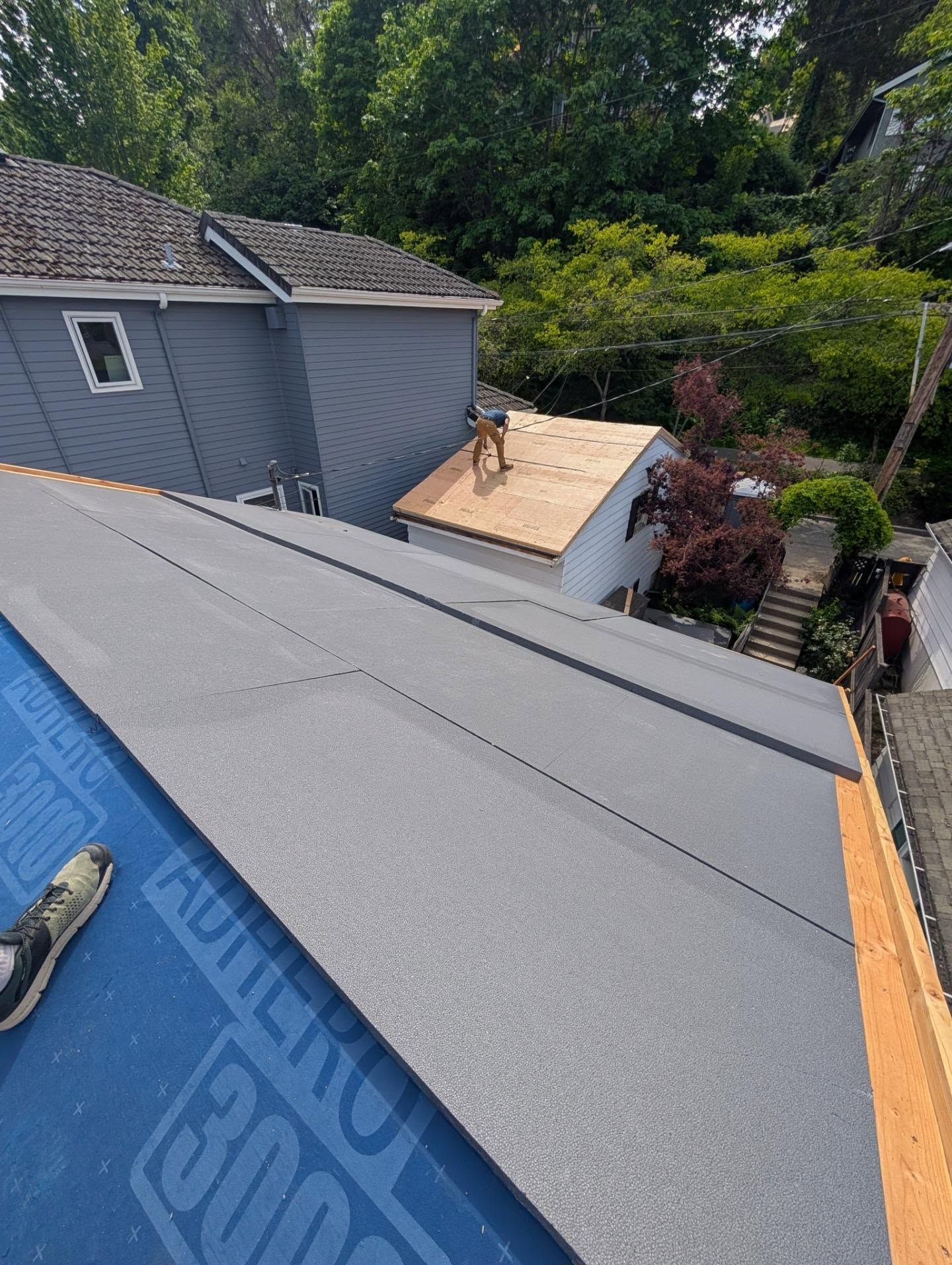 Next steps on this roof is laying 2 layers of GPS foam and then a top layer of plywood screwed through to structure underneath with 6" screws.
With our "L" curb detail, the first layer of 1-1/2" foam planes with the bottom 2x4, then the 2" layer brings it up flush with top of curb. 1/2" CDX plywood sandwiches it all together and provides backing for metal roof fastening.
This is not a true "monopoly" roof since we are not cleanly connecting the wall to roof seam. But the rigid insulation layer is purely continuous and will provide R-18 over the R-23 cavity for decades. Nice roof.
(Pics are a mix of detached garage and main roof)