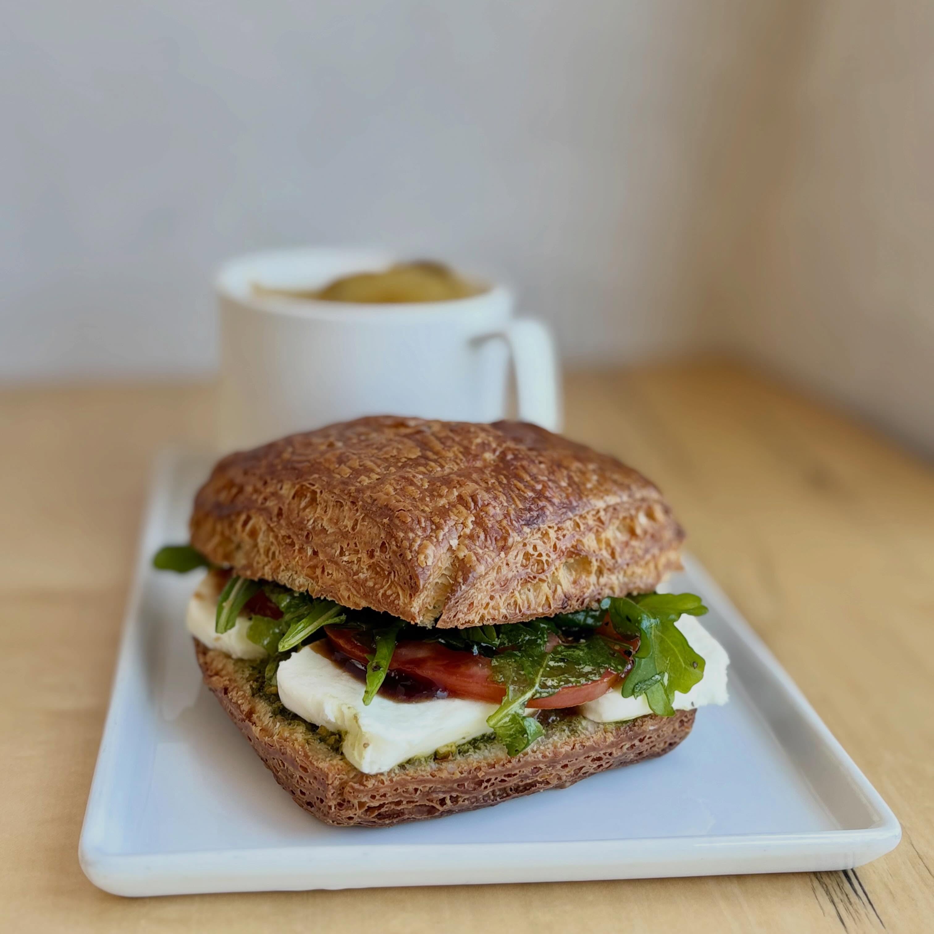 New veggie sandwich just dropped! Come try our new caprese sandwich on a croissant 🥐