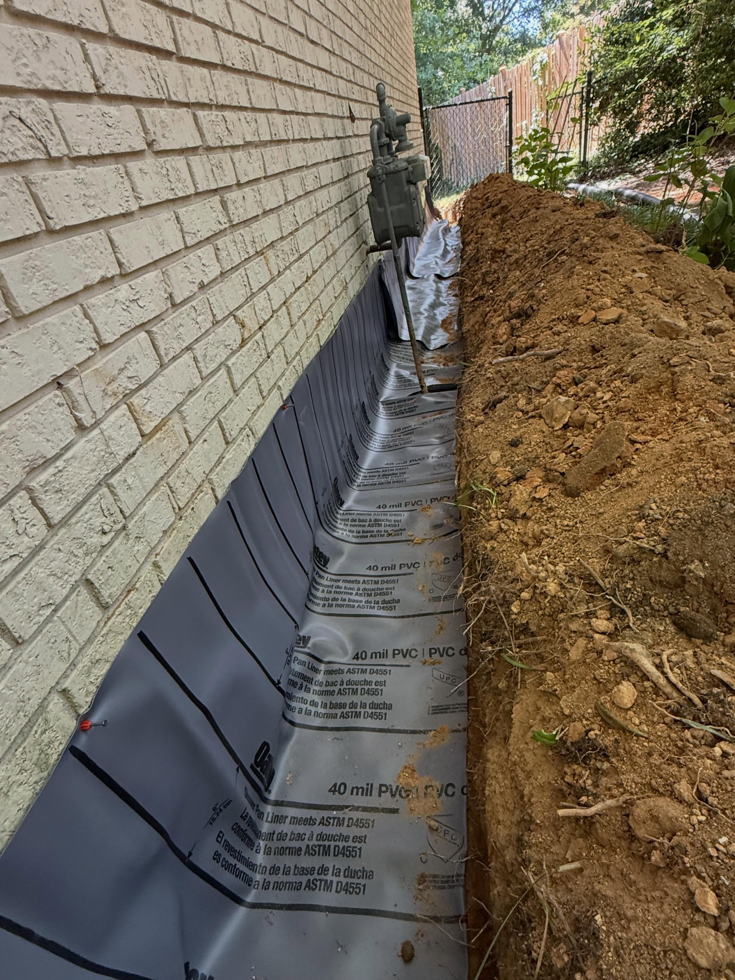 J Channel French drain system so solve this issue. This customer was getting water in their crawlspace during heavy rains. They wanted to encapsulate the crawlspace, but not until they were sure that water problem was taken care of. Problem solved. 40 mill rubber membrane, perforated dual wall drain line, #57 filtration stone, backfill and create positive grade away from structure.