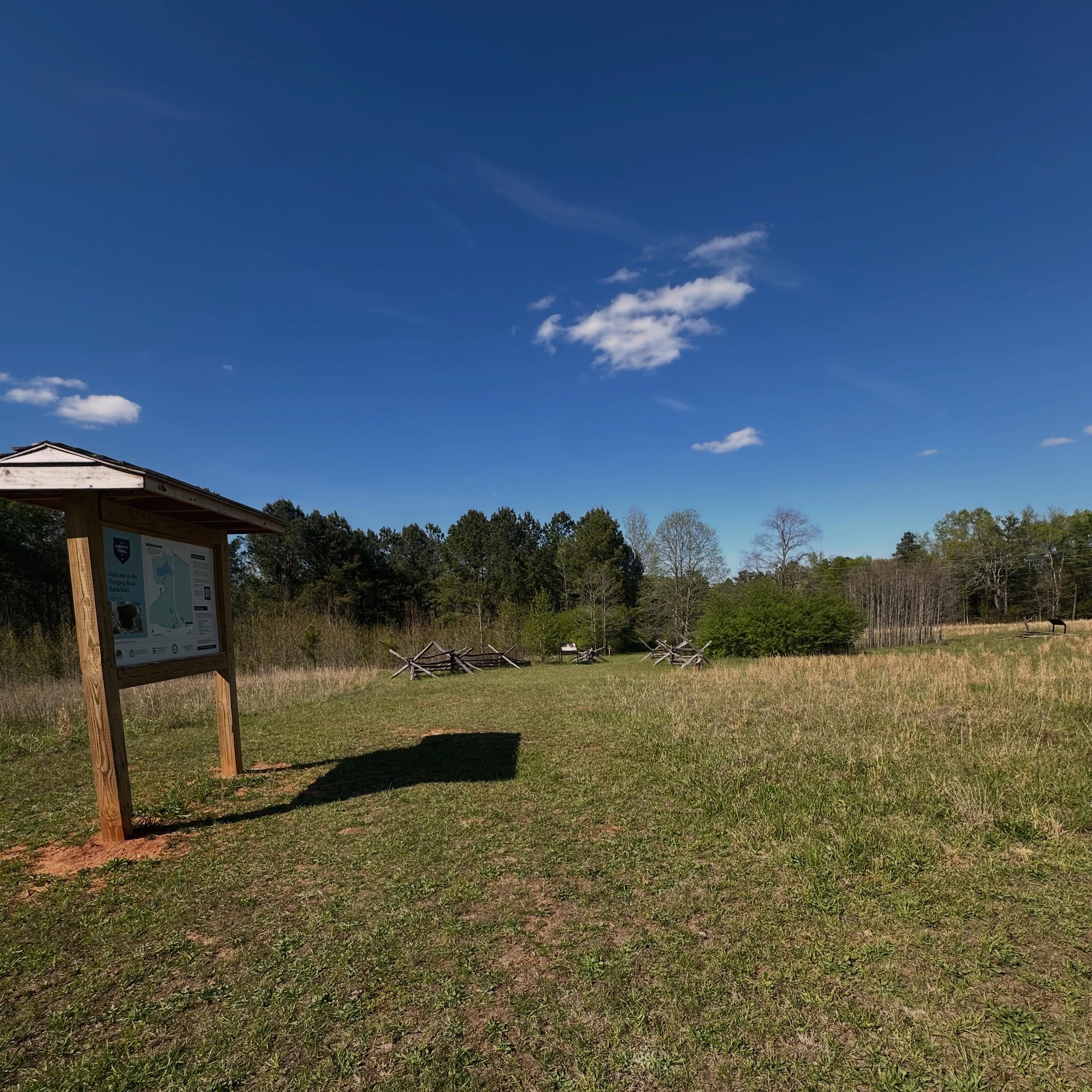Today the National Trust for Historic Preservation released its 39th annual list of America’s 11 Most Endangered Historic Places, and among the sites recognized is an important piece of South Carolina’s Revolutionary War history.
The Battle of Hanging Rock site in Heath Springs commemorates the August 6, 1780 battle in which Patriot militia forces led by Thomas Sumter, alongside many Catawba warriors, fought British and Loyalist troops commanded by John Cruger. The battle occurred just months after the fall of Charleston and was part of a broader campaign to challenge British outposts across the South Carolina backcountry.
Today, visitors to Hanging Rock Battlefield can explore a 0.7-mile interpretive trail featuring eight stops that highlight the history and significance of the site. However, only a small portion of the original 600-acre battlefield has been preserved. Rapid population growth and ongoing development pressures threaten to fragment the battlefield’s remaining core acreage, underscoring the urgent need for additional land acquisition, park development, and long-term stewardship efforts.
A coalition led by the American Battlefield Trust — including the South Carolina Battleground Preservation Trust, South Carolina 250 Commission, South Carolina State Parks, and Friends of Hanging Rock — has been actively working to protect key portions of the battlefield and improve public access through enhanced signage, walking tours, and preservation initiatives.
Now in its 39th year, the National Trust’s endangered places program continues to be one of the nation’s most effective tools for raising awareness about threatened historic resources. Since its inception, the initiative has helped galvanize public support for more than 350 historic sites across the country, with only a small number ultimately lost.
In recognition of the 250th anniversary of the Declaration of Independence, this year’s list highlights eleven places that reflect the enduring principle that all people are created equal. For the first time, each featured site will also receive a one-time $25,000 grant from the National Trust to support ongoing preservation efforts.