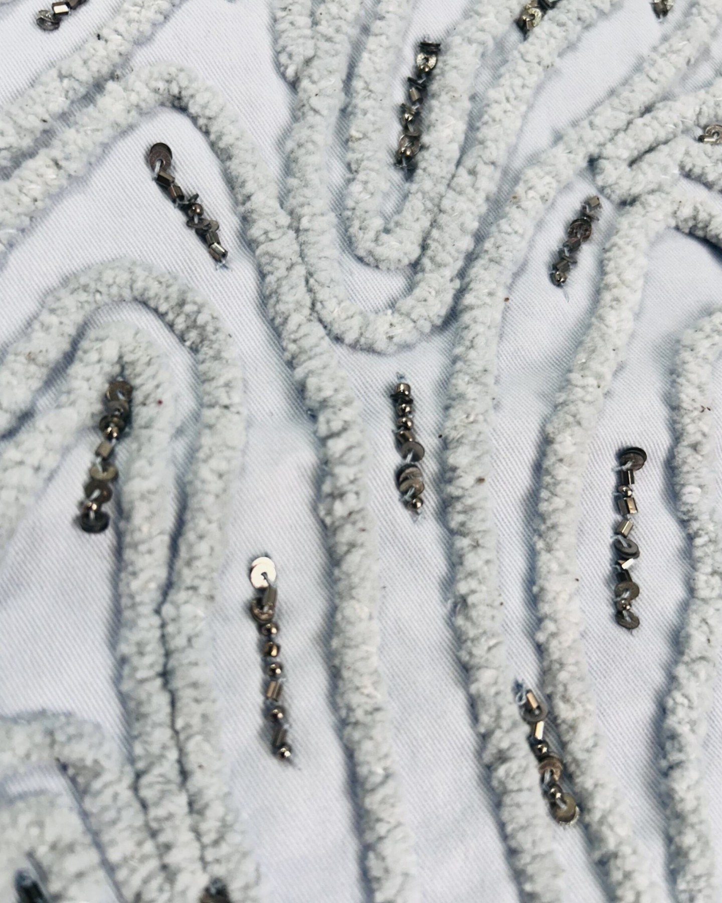 Most people never see this part.
This is chenille cord embroidery with hand-placed metallic beadwork — every curve stitched in sequence, every bead set individually by hand. It takes time that most manufacturers are not willing to give it.
We are.
The detail in a garment is what separates something worn once from something kept for years. This is the level we work at and it is available to every brand that partners with us.
Compass Tex.
#CompassTex #EmbroideryDetail #ChenilleEmbroidery #Beadwork #FashionCraft #GarmentManufacturing #FashionManufacturing #HandEmbroidery #FabricDetail #FashionProduction #CraftInFashion #SlowFashion #MadeWithCare #FashionBusiness #TextileArt