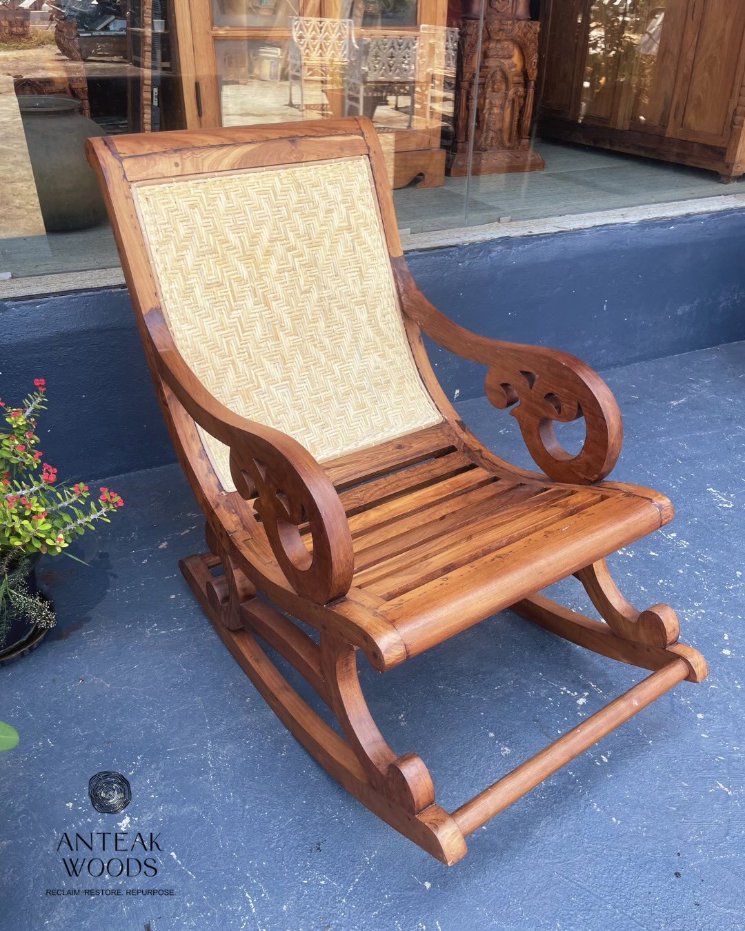 Timeless comfort in a handcrafted teak wood rocking chair.
