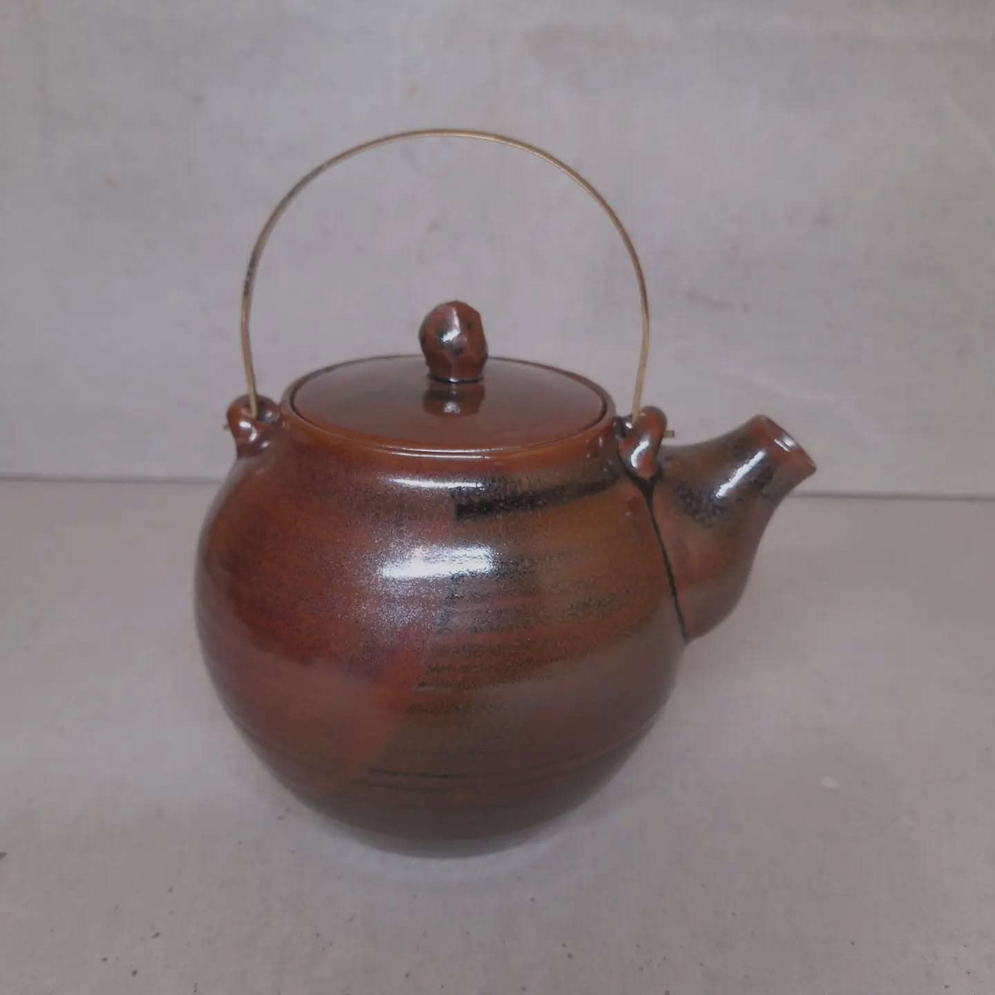 Me and this teapot made a deal... the lid was coming off!
Sometimes I look at glaze before it goes in yhe kiln and think "she'll be right"
...but that attitude melts at 1300⁰ and a lid can fuse to the pot body...but we had a deal...and I persevered with every tool in the book.
I could hear @glenavon102 quoting @grannysmith1910 in my head as I soaked it in water then tap, tap, tapped.. everytime listening to the tone of the tap...and then it let go perfectly...
A quick clean up and we shall be drinking tea from it @objectspace May 30th at 1.30pm I'd love you to come and hear more about these glazes and the New Zealand materials they are made from.