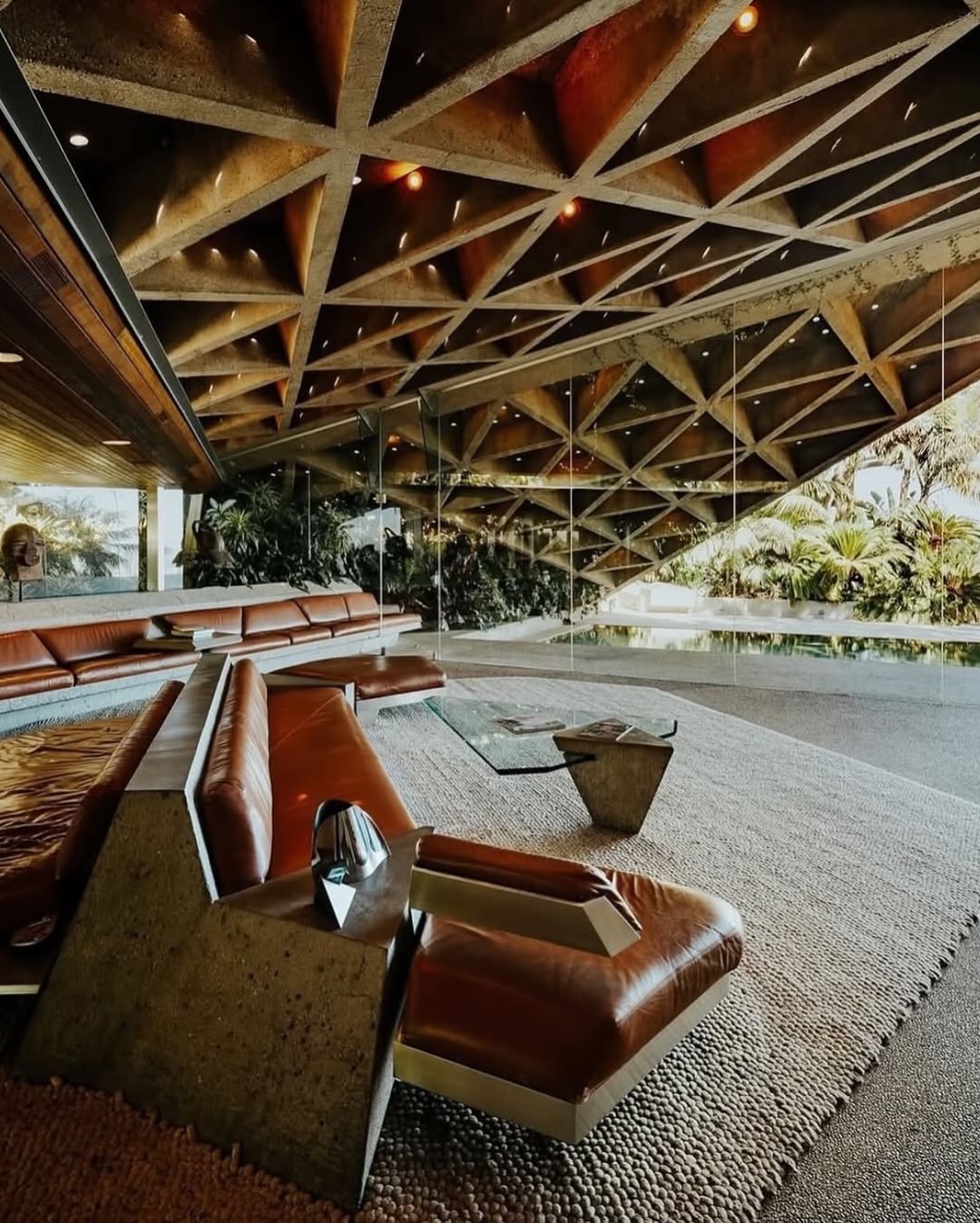 The Sheats-Goldstein Residence, designed by John Lautner between 1961 and 1963, remains one of the most extraordinary houses in Los Angeles; less a private home than a piece of cinematic architecture carved into the hillside.
Originally built for Helen and Paul Sheats, the house is a radical example of Lautner’s organic modernism: concrete, glass, timber, and geometry pushed to the edge of both engineering and fantasy. Its triangular concrete roof planes, frameless glass walls, built-in furniture, and dramatic relationship to the surrounding canyon make the building feel almost geological; as if it has grown out of the slope rather than been placed upon it.
What makes the residence even more remarkable is its second life under James Goldstein @jamesfgoldstein , who acquired the house in the 1970s and worked closely with Lautner, and later with architect Duncan Nicholson, to expand and refine it over several decades. Rather than treating the house as a static icon, Goldstein continued Lautner’s vision as a living project: adding the famous infinity tennis court, the James Turrell Skyspace, and eventually the nightclub-like Club James beneath the property.
The result is one of the rare modernist houses that has remained experimental long after its completion. It is architecture as lifestyle, sculpture, performance, and myth suspended somewhere between Los Angeles glamour, utopian modernism, and pure architectural obsession.
🎥📸Photography @sterlingreed.us
#johnlautner #sheatsgoldsteinresidence #architecture #losangeles #history